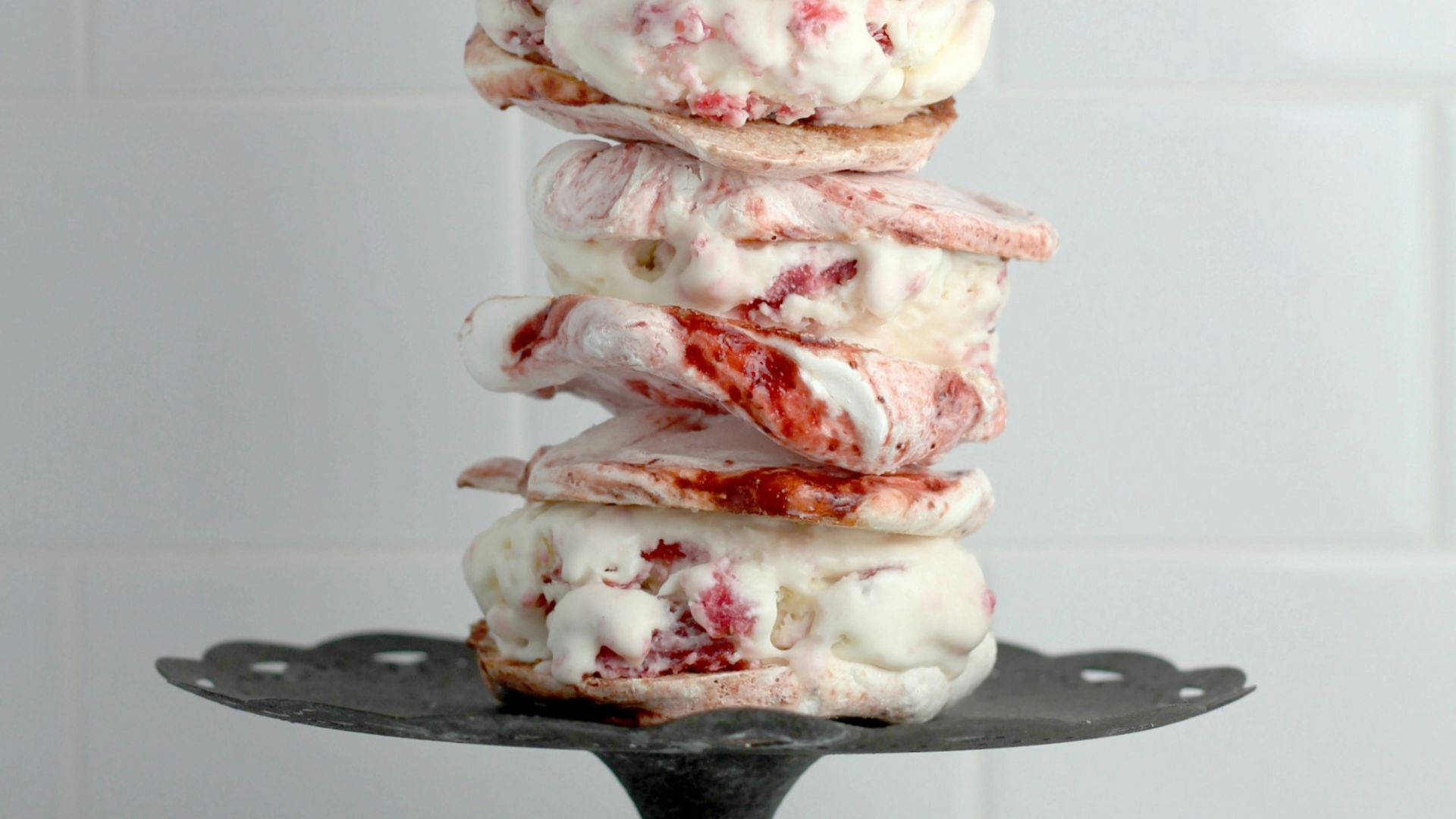 pile of burger on cake stand