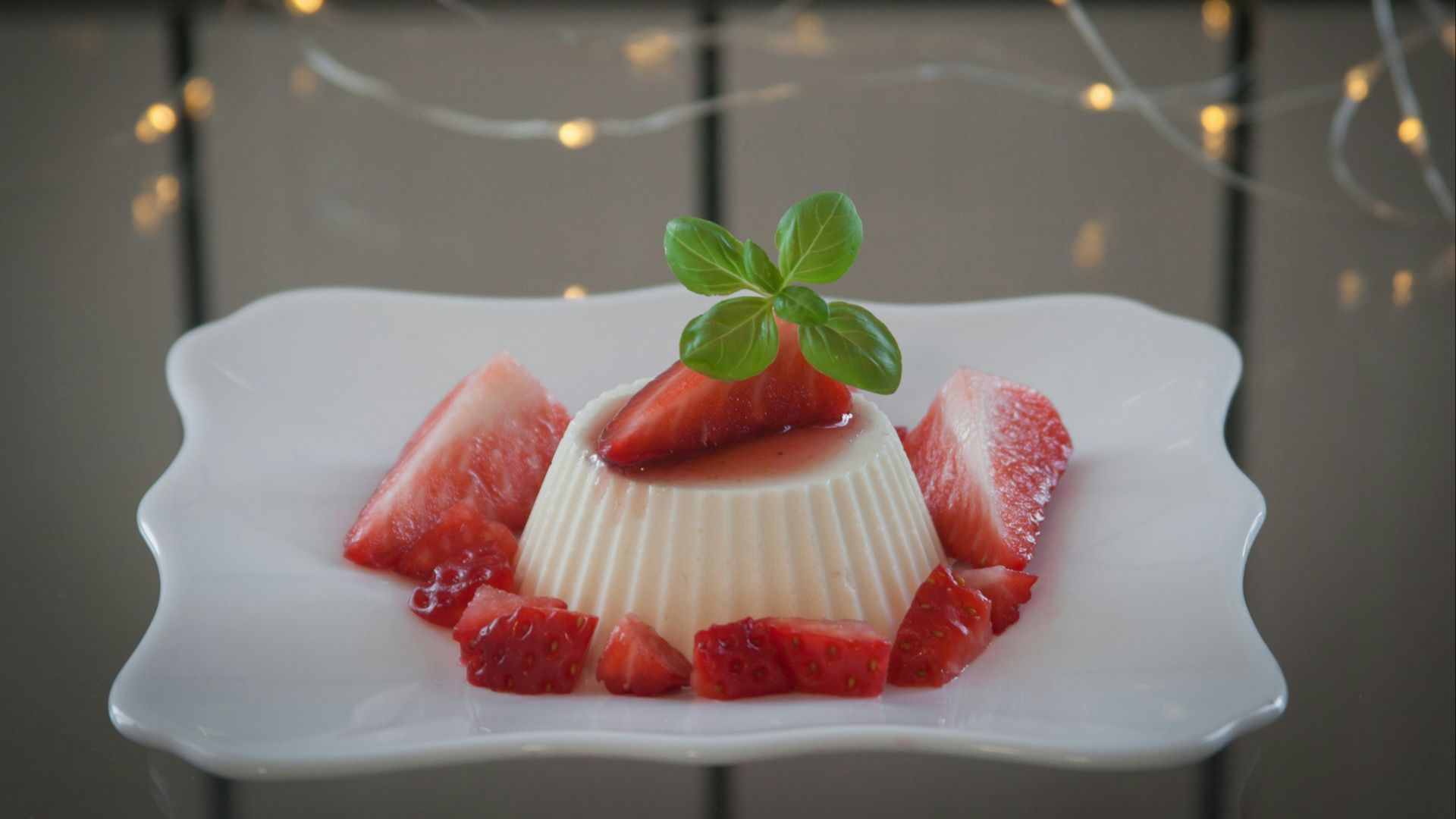 strawberry on white ceramic plate