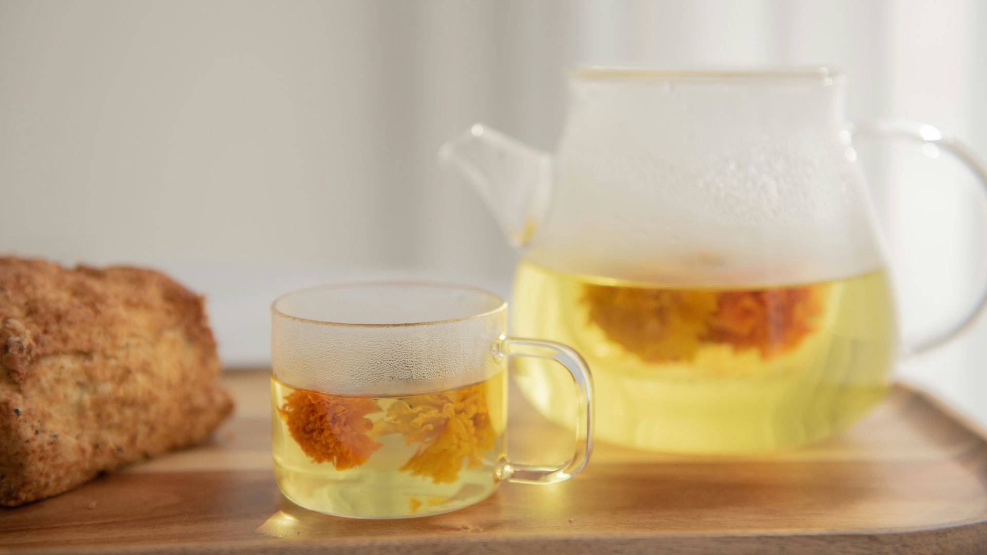 clear glass pitcher with yellow liquid