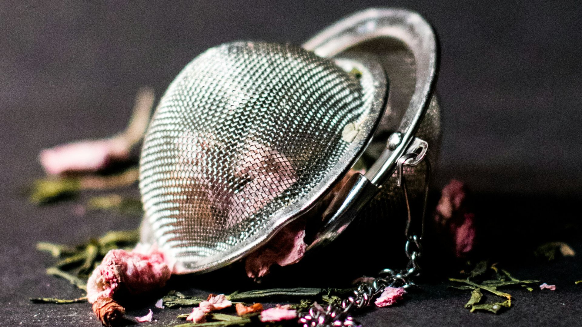 selective focus photography of round silver-colored accessory