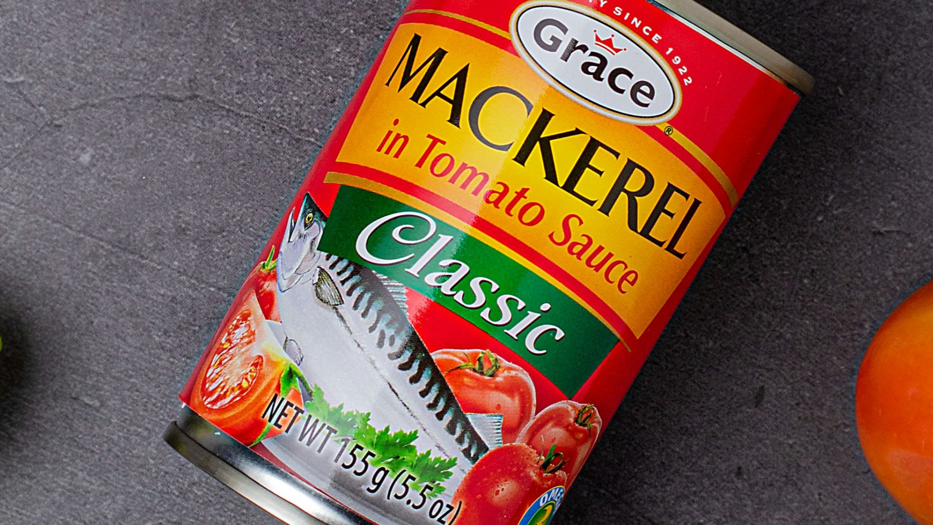 a can of canned food next to some vegetables