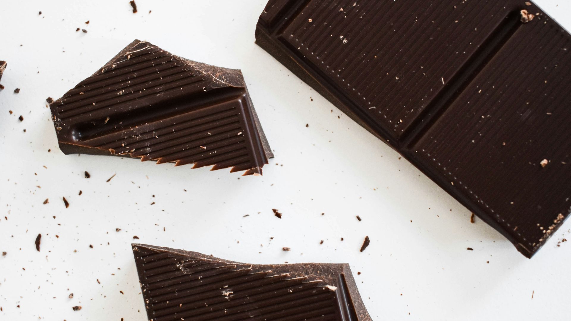 four pieces of chocolate sitting on top of each other