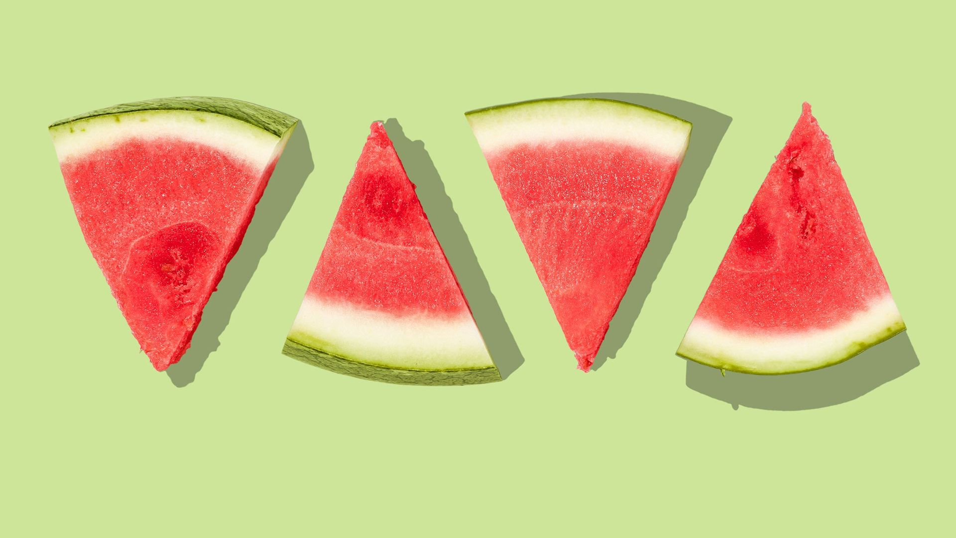 sliced watermelon with green background