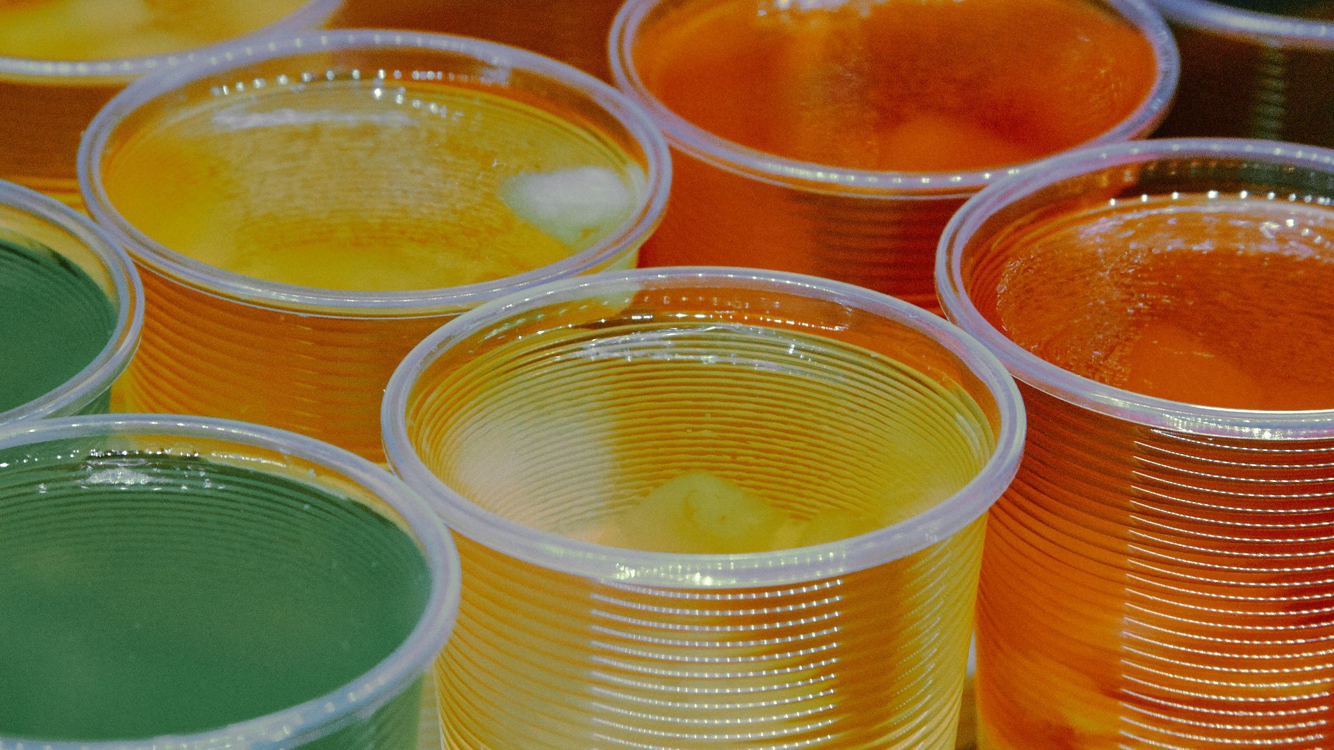 clear glass jars with yellow liquid
