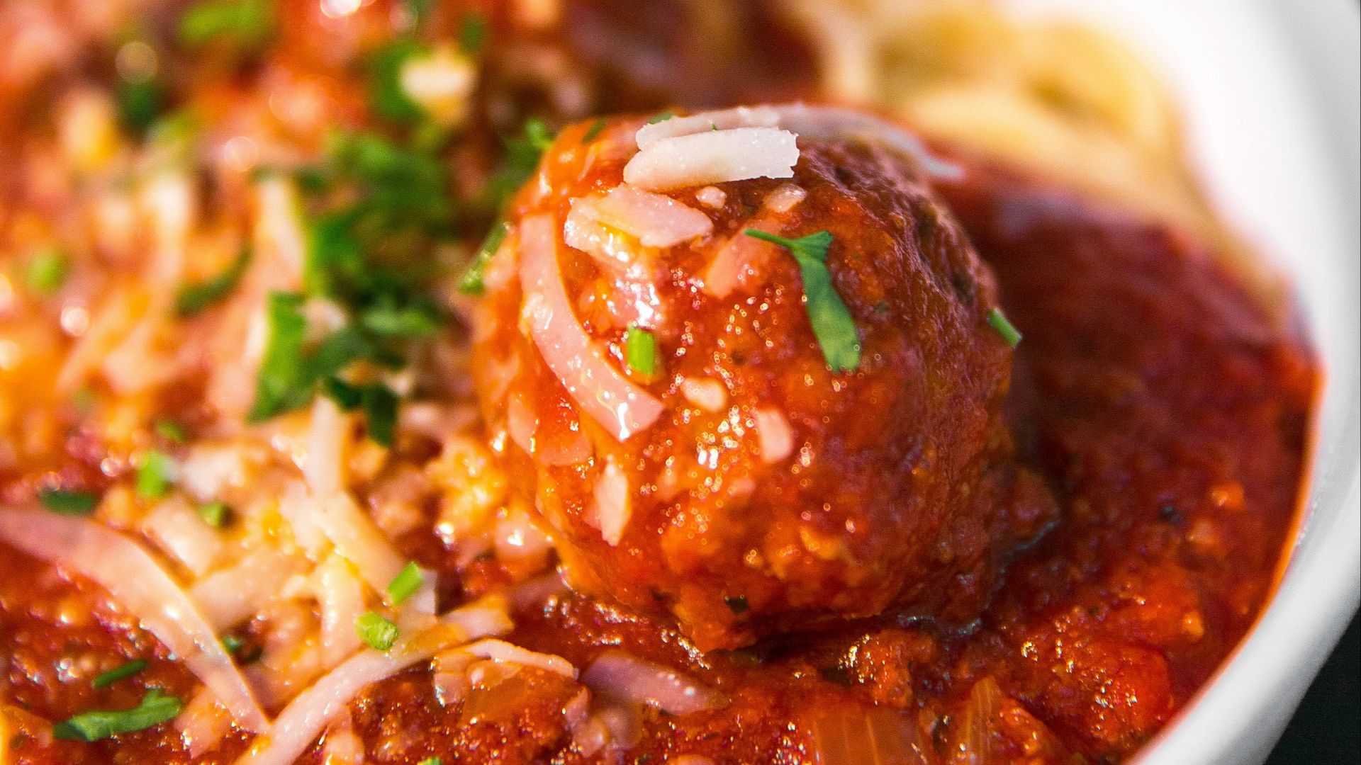 meta balls with noodles served on white ceramic bowl