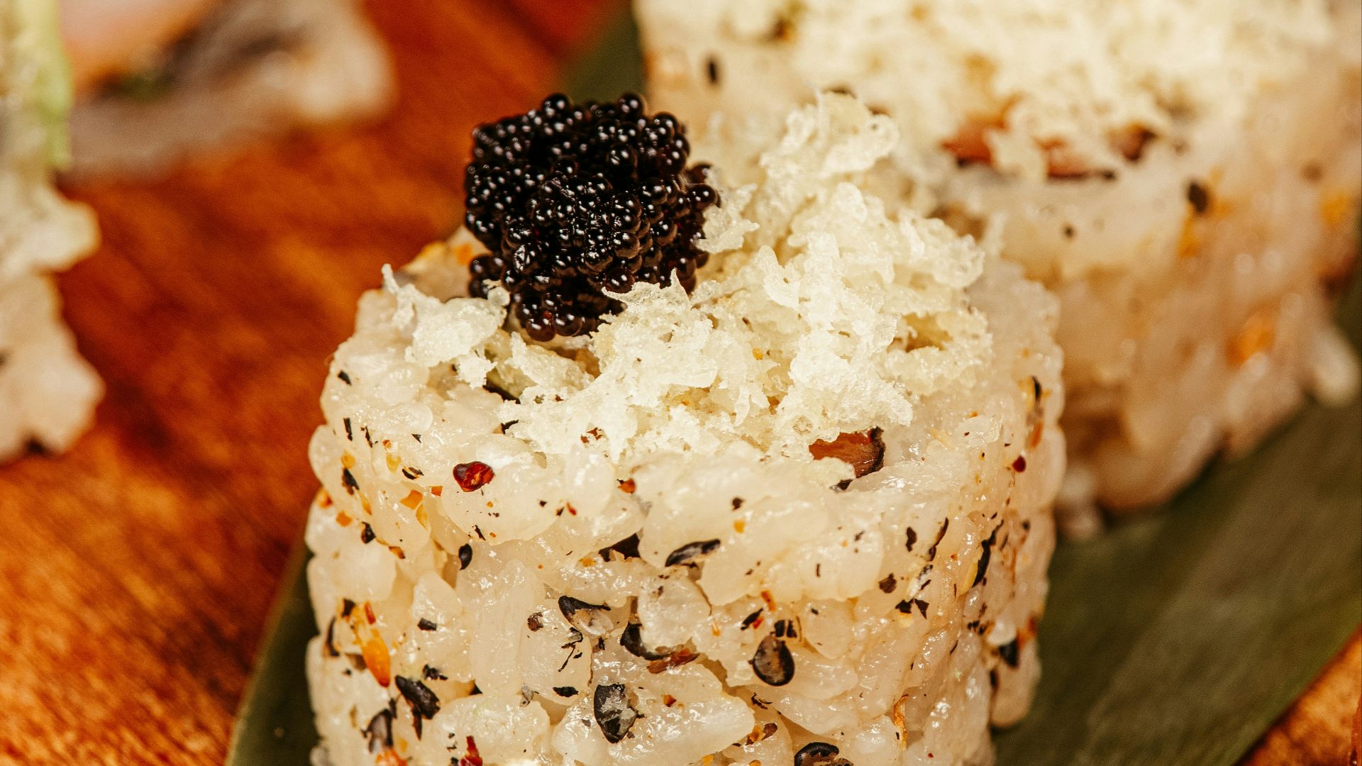 A close up of sushi on a plate on a table