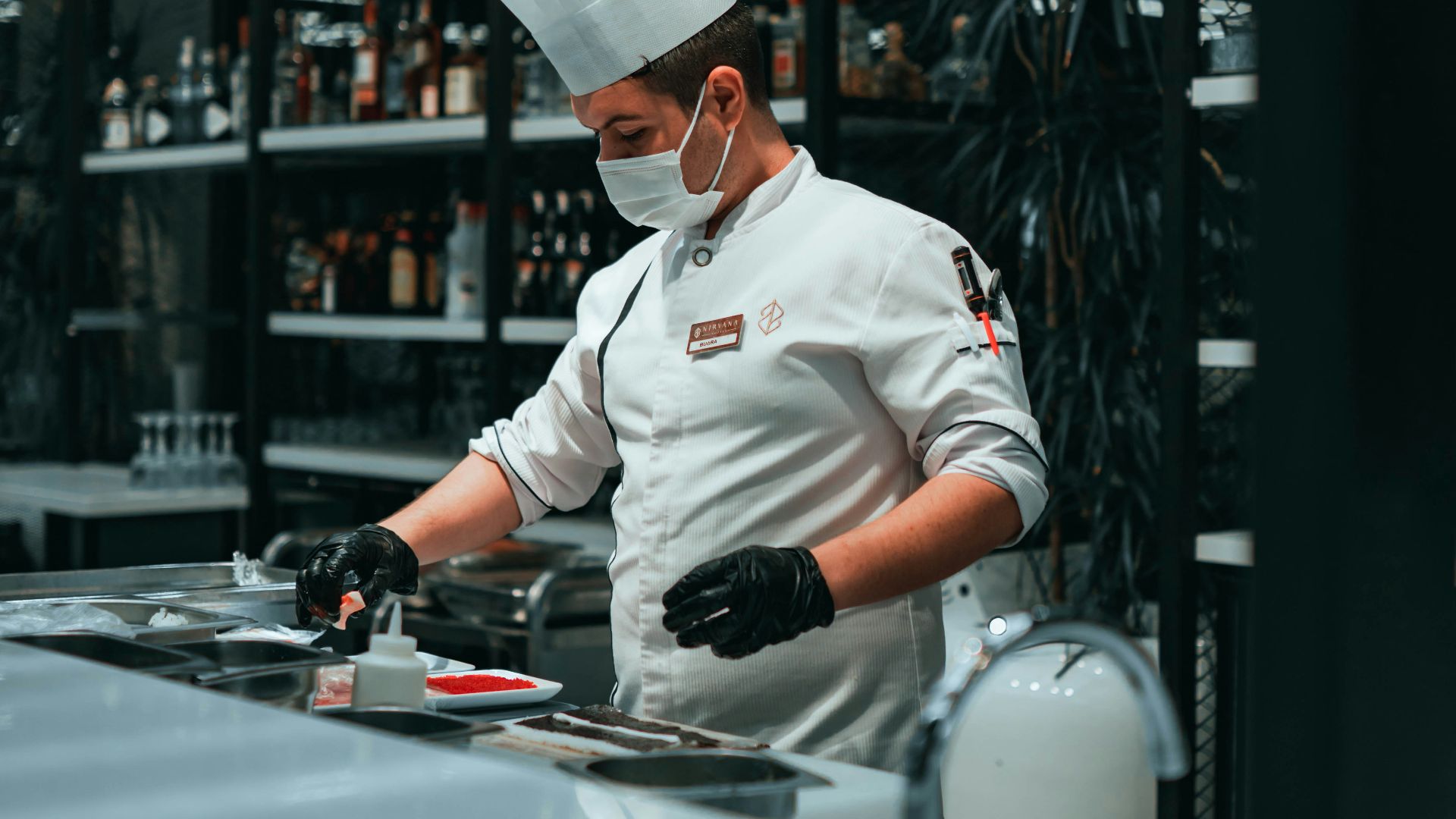 a man in a chef's hat is cooking in a kitchen