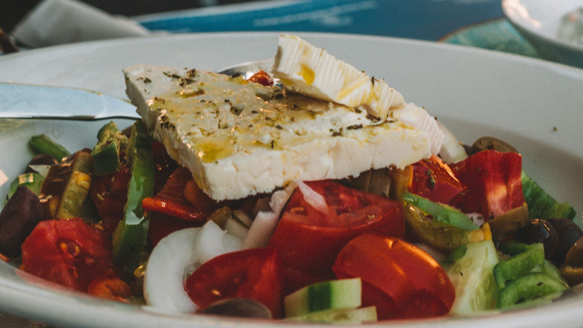 sliced tomato and cucumber on white ceramic plate