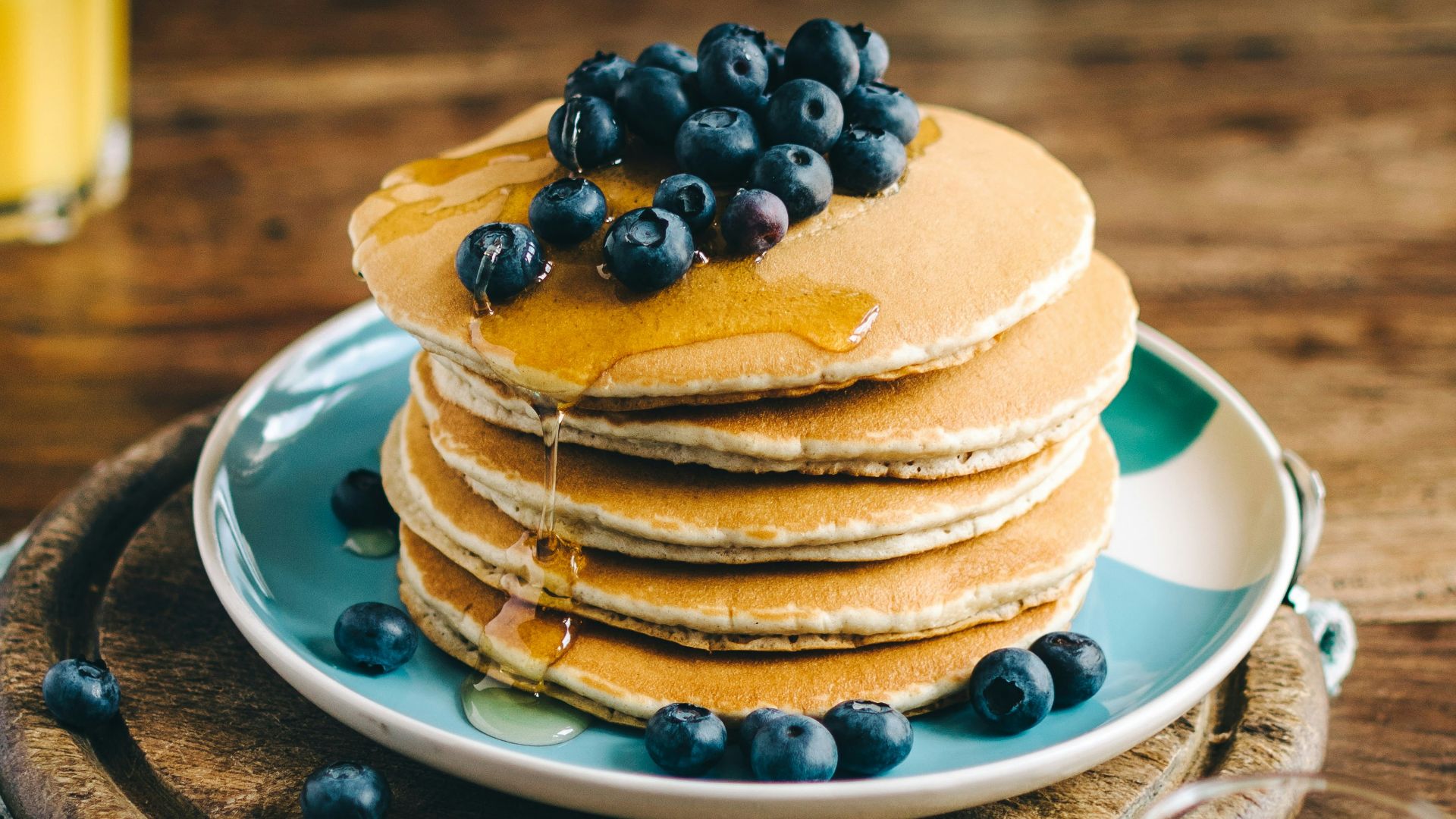 blue and white ceramic plate with pancakes