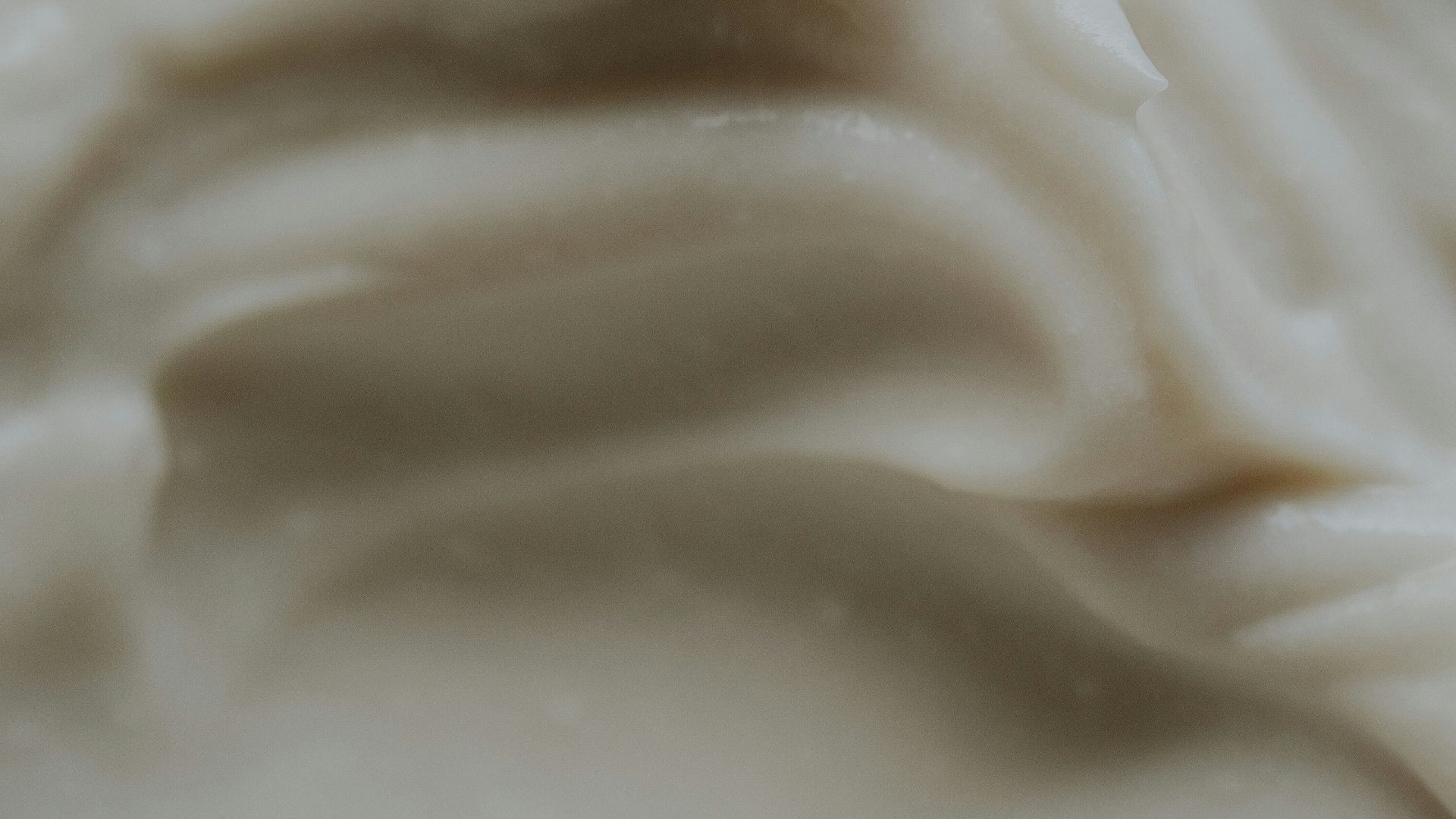 A close up of a white frosted cake