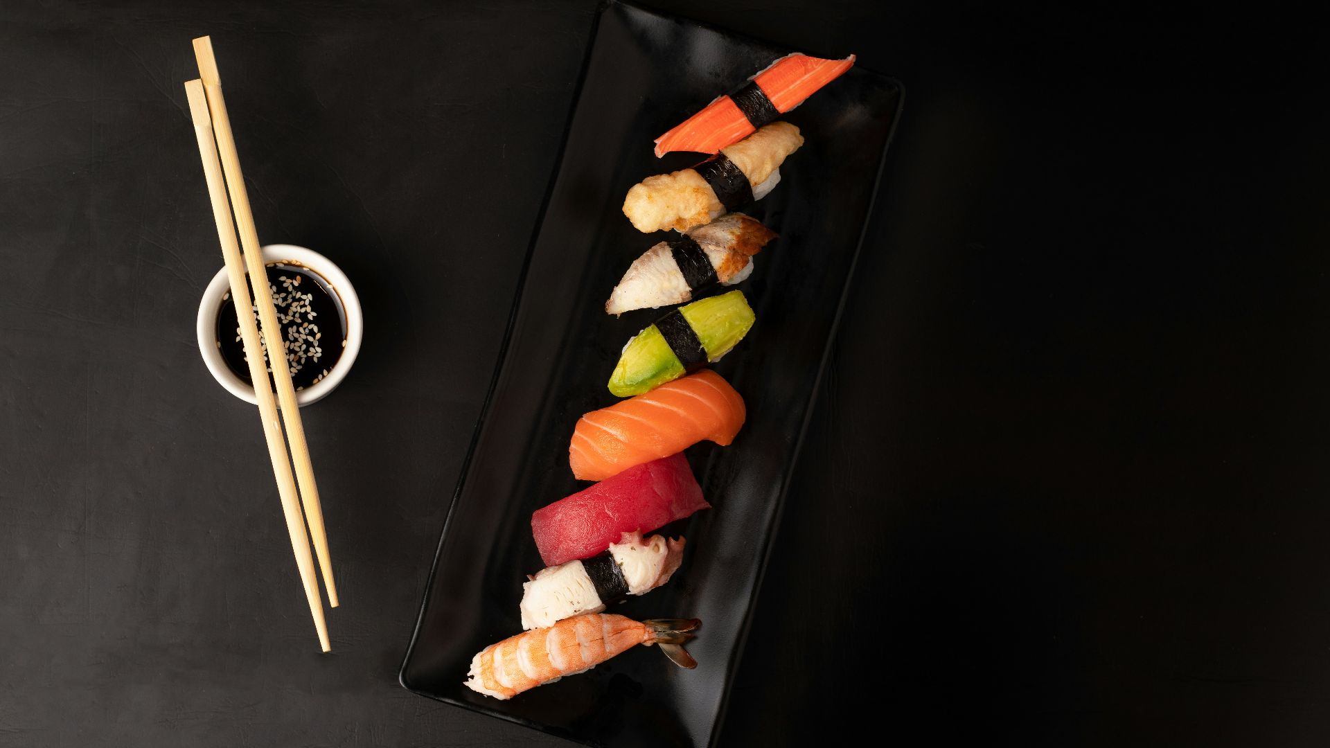 sushi on black square plate