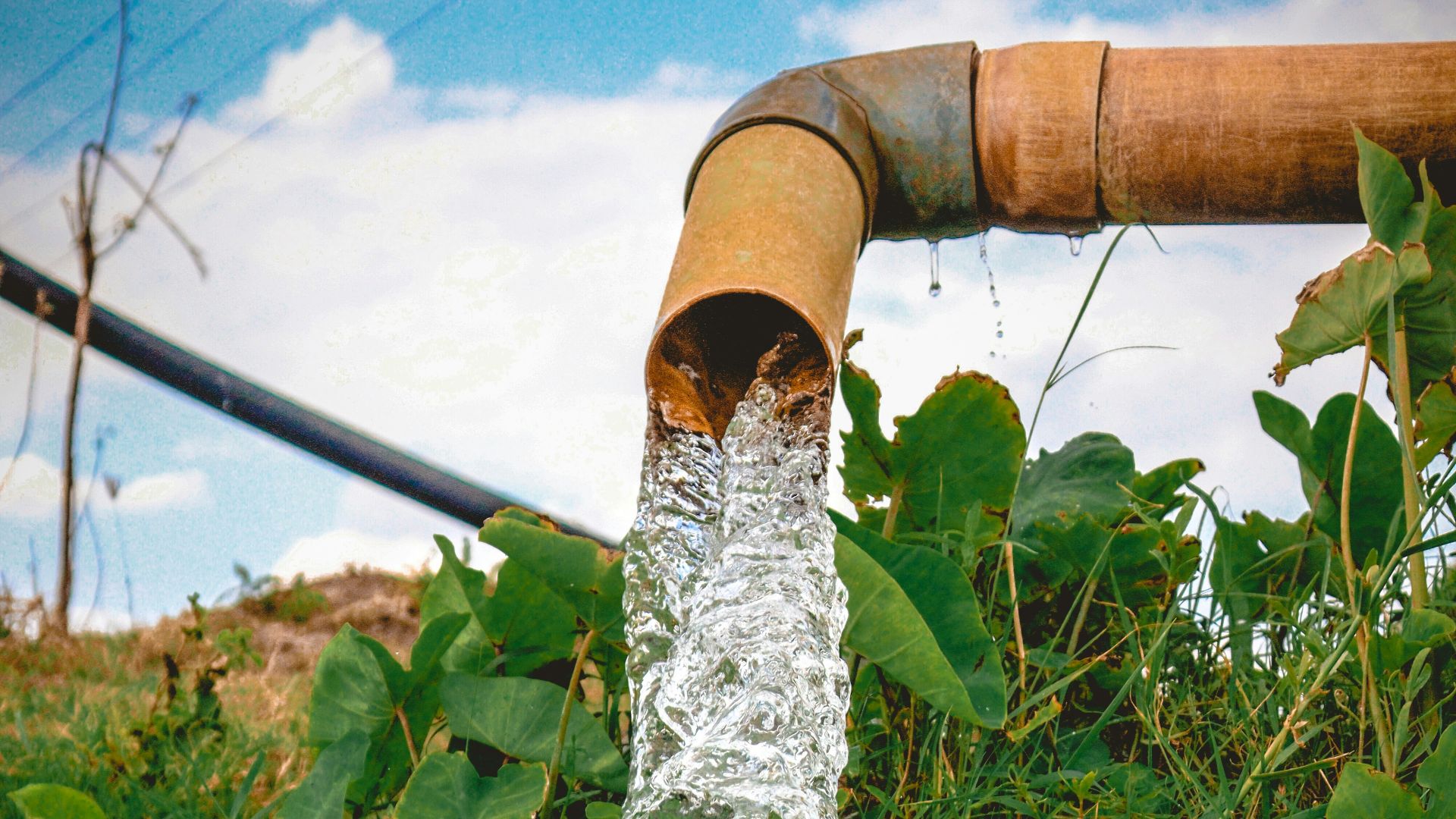 a pipe that has water coming out of it