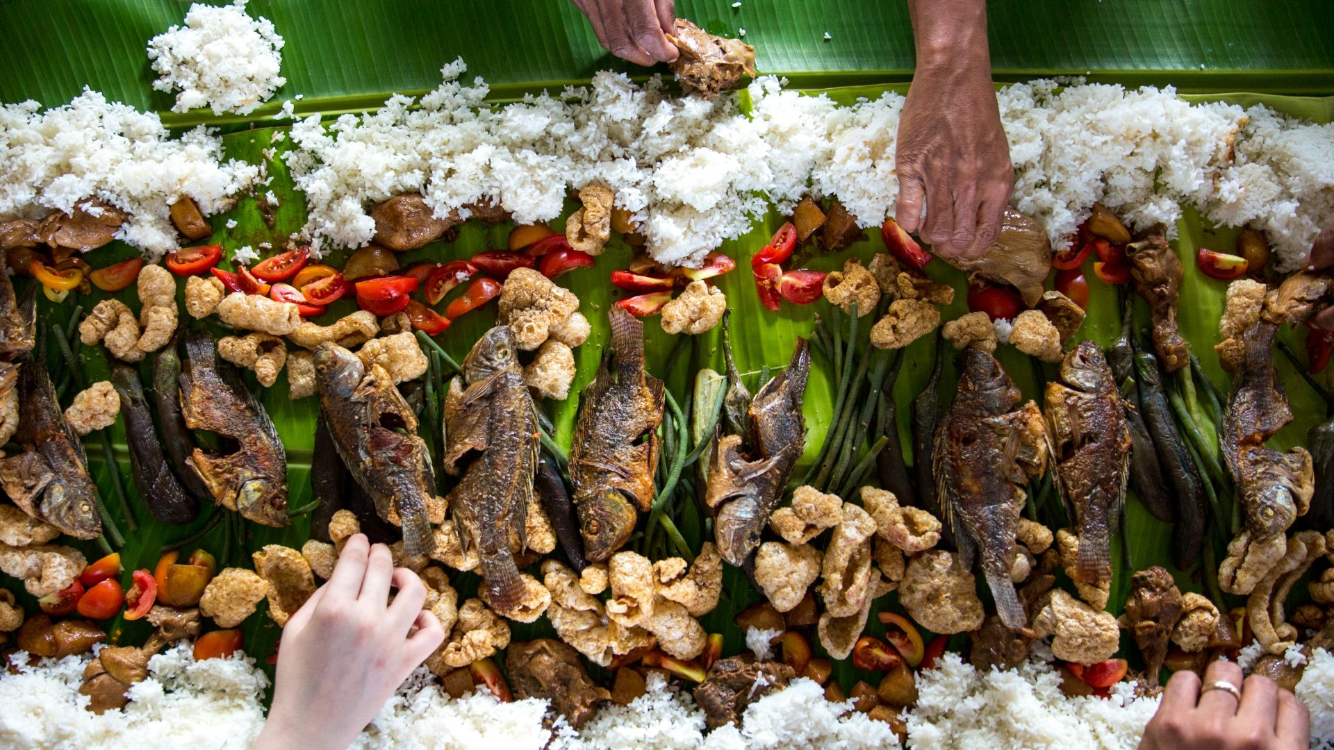 photo of people eating rice