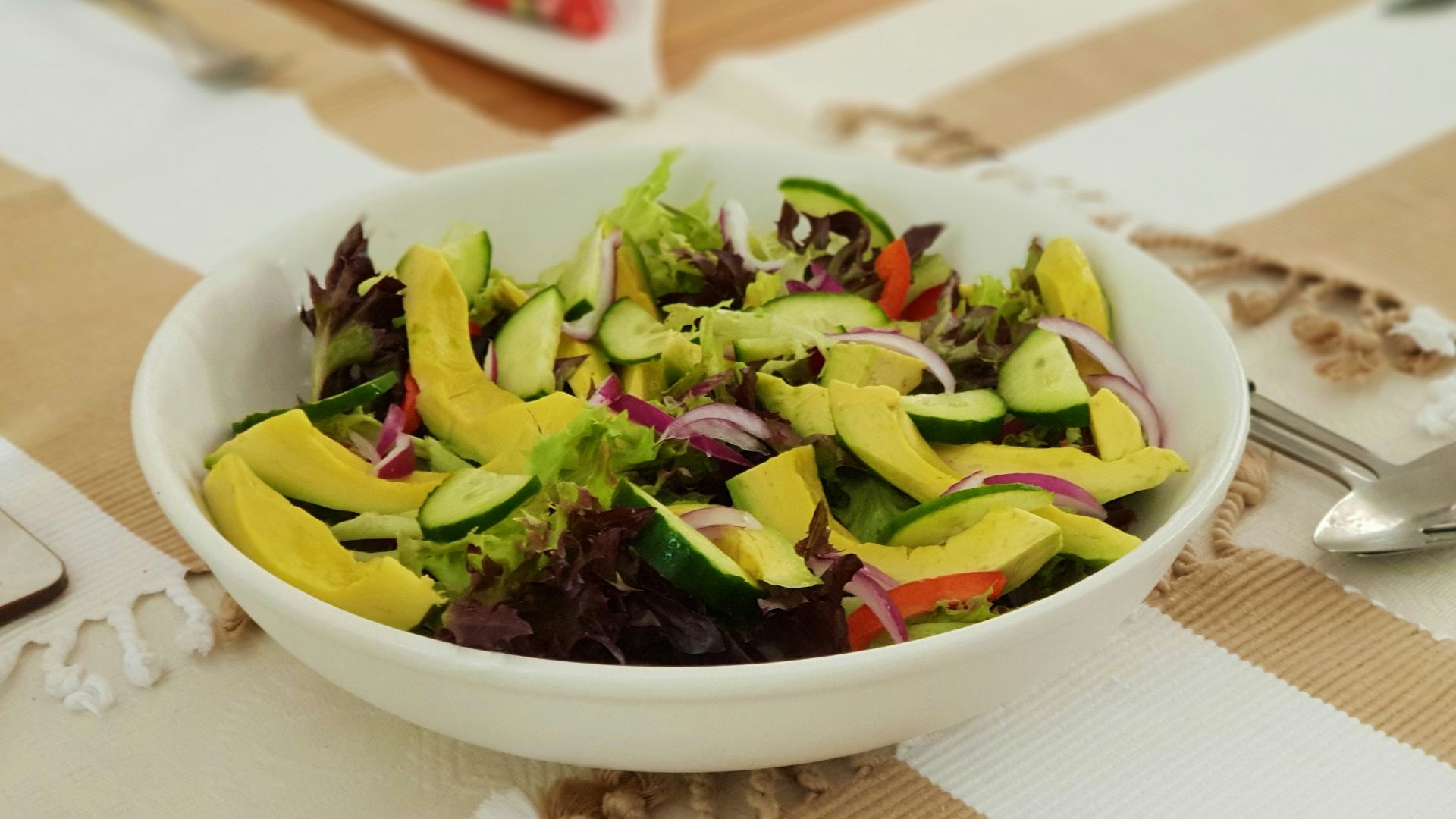 sliced vegetables in ceramic bolw