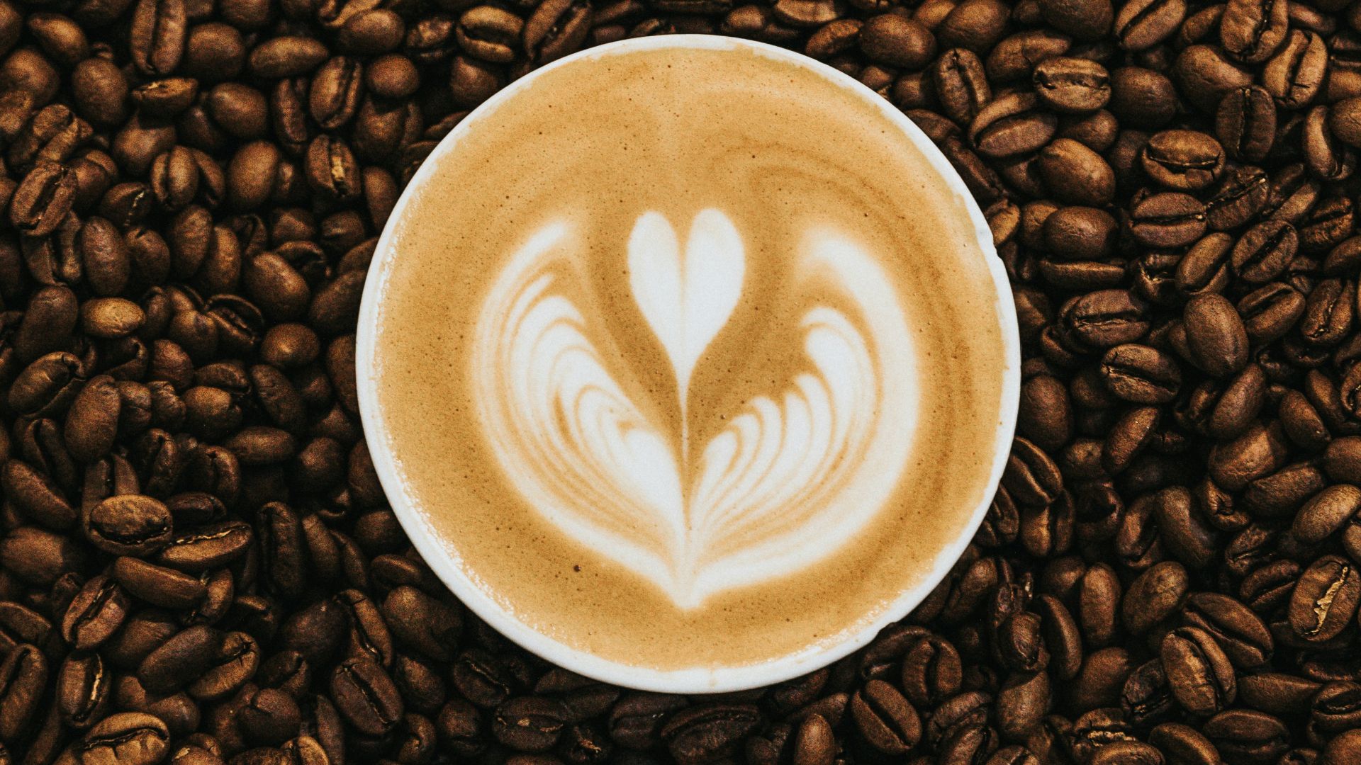 top view photography of heart latte coffee