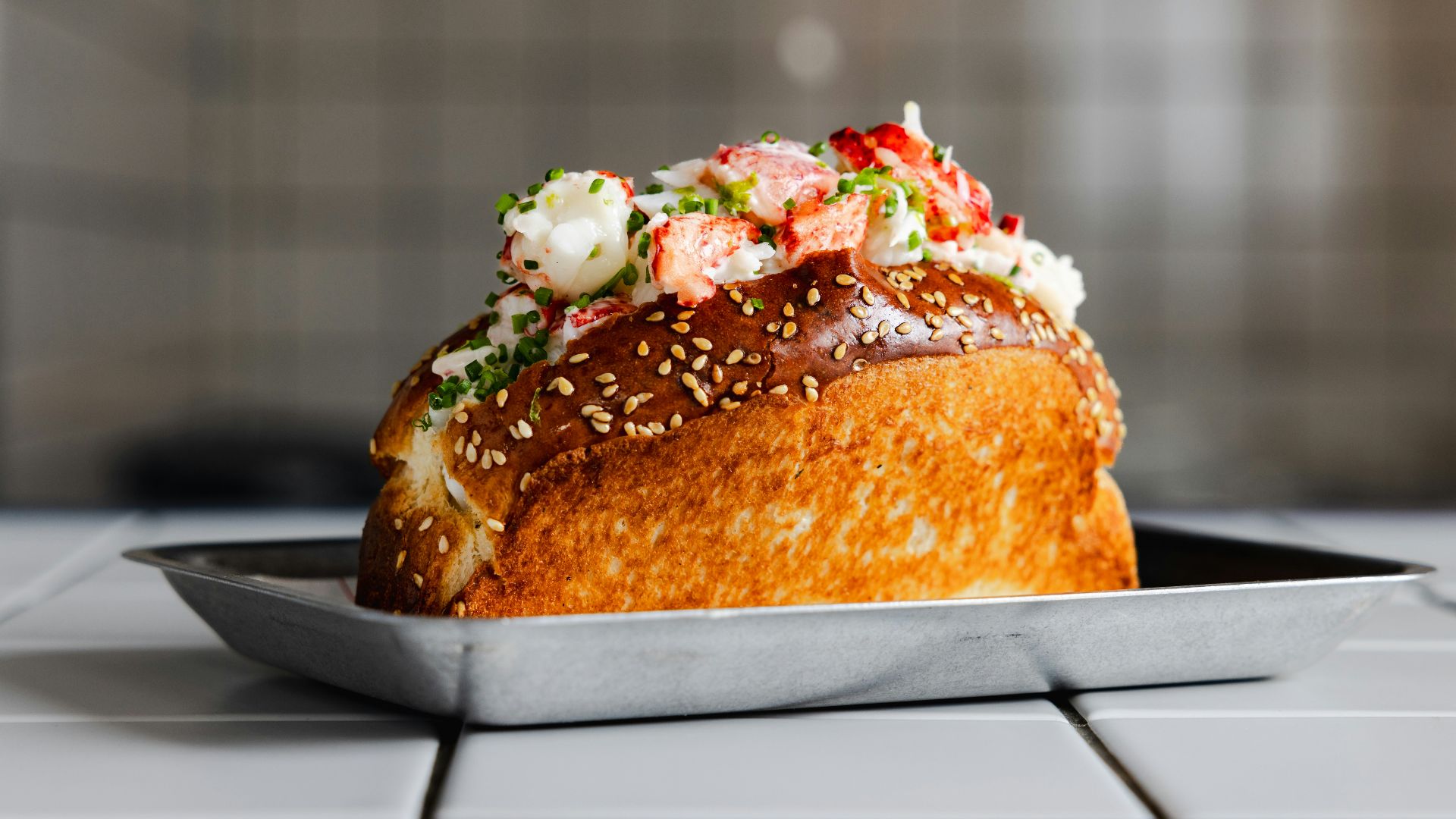 A delicious lobster roll on a plate.