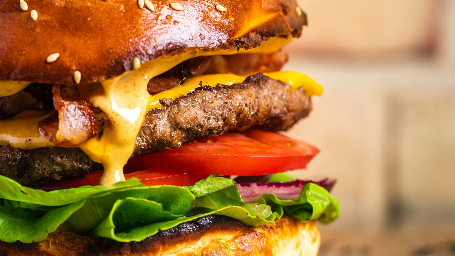 a cheeseburger with a sesame seed bun