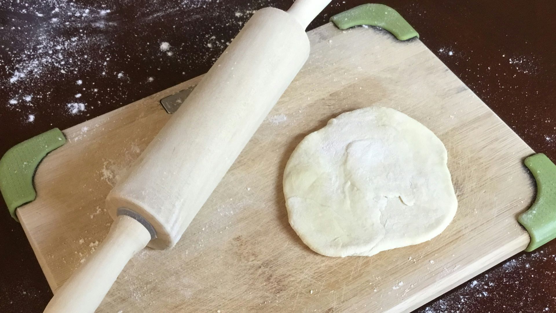 white dough on brown wooden chopping board
