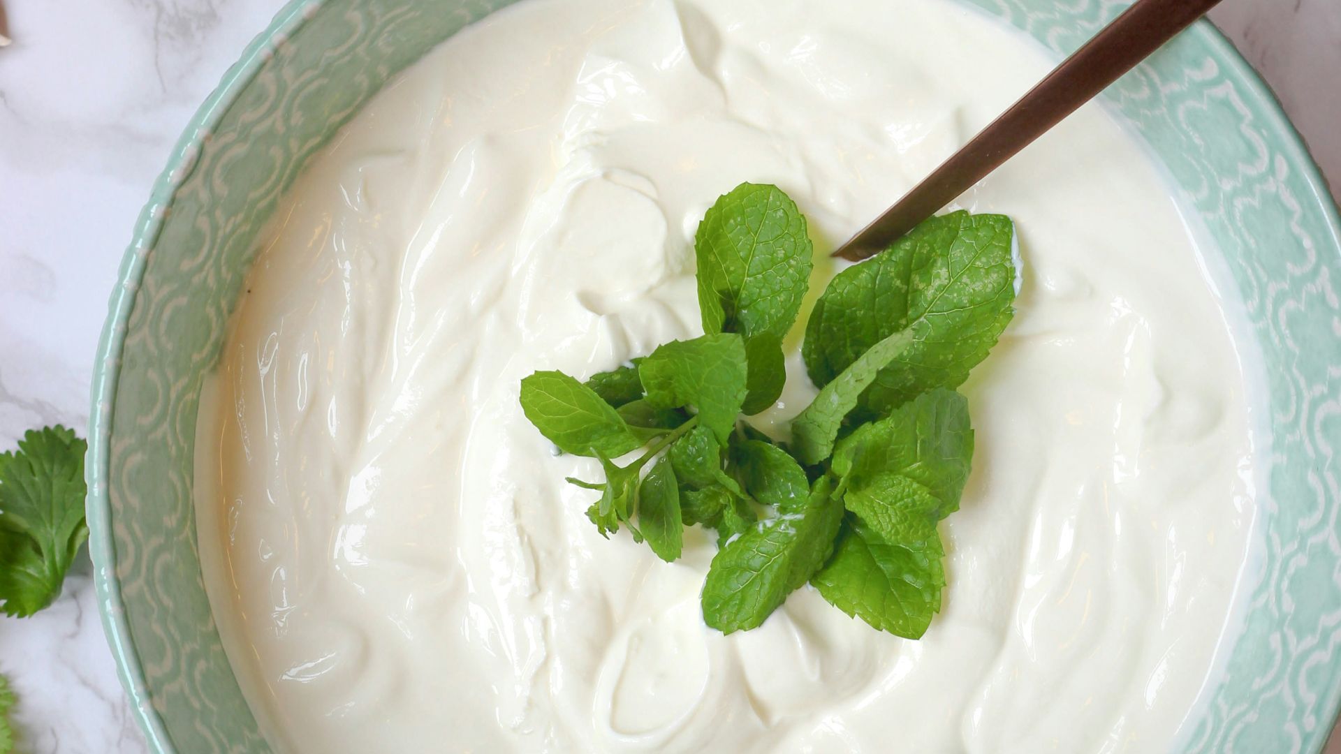 a bowl of yogurt with a spoon in it