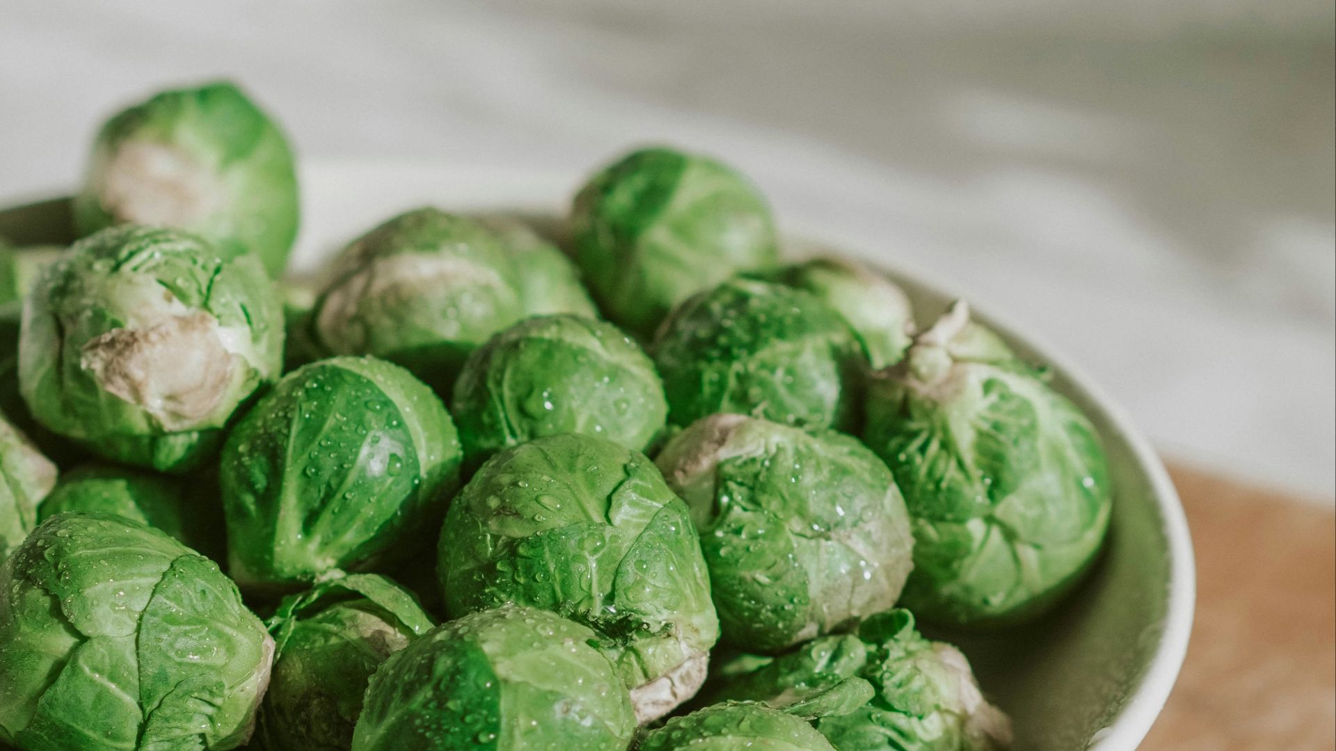 green vegetable on white ceramic bowl