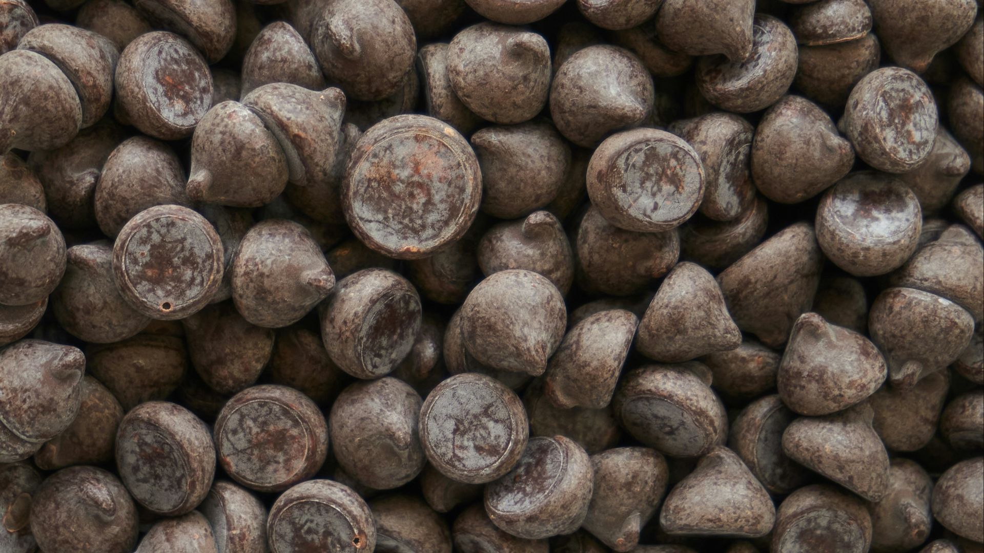 brown coffee beans on brown wooden surface