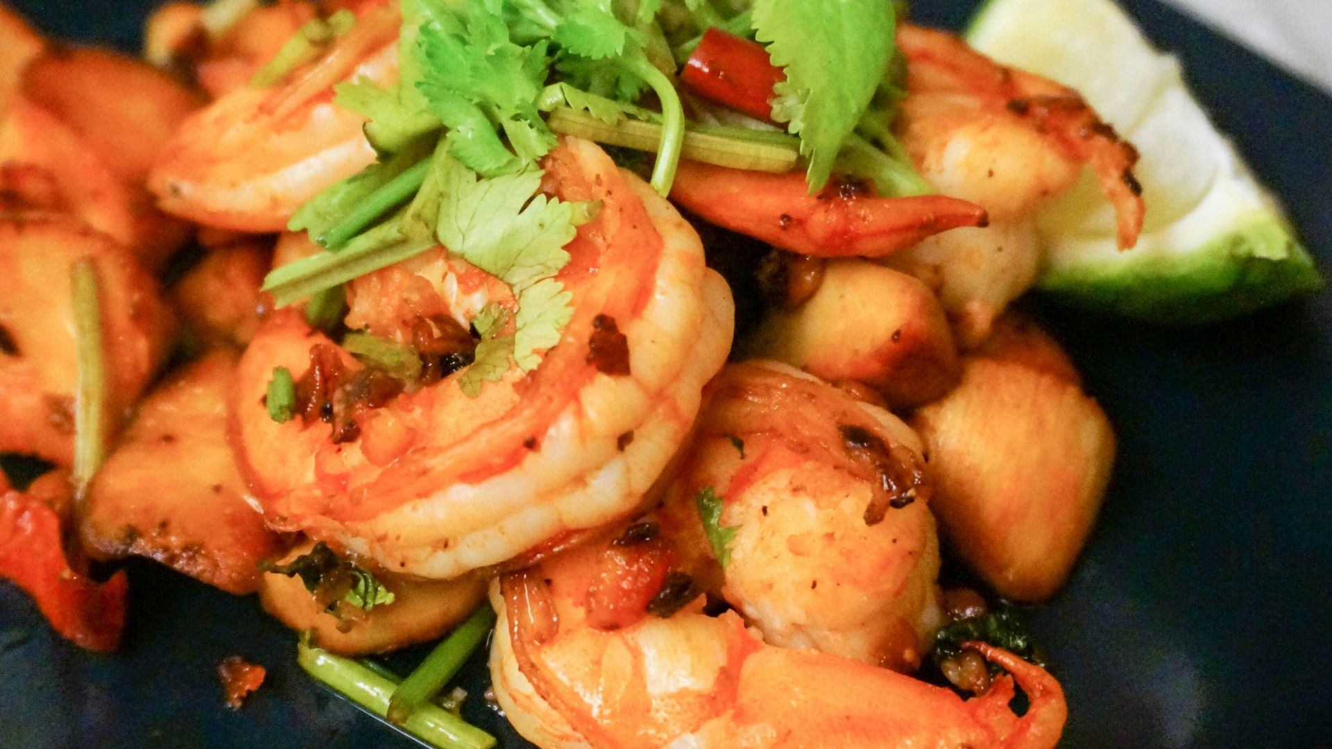 cooked shrimps on blue ceramic plate