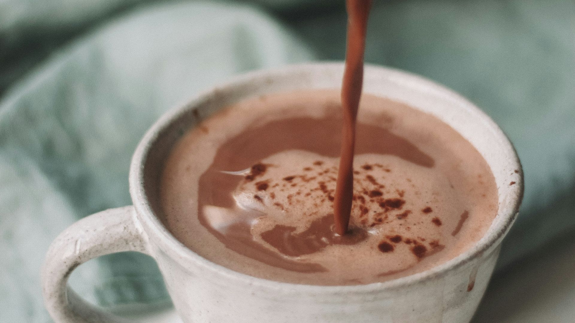 chocolate coffee pouring in white mug