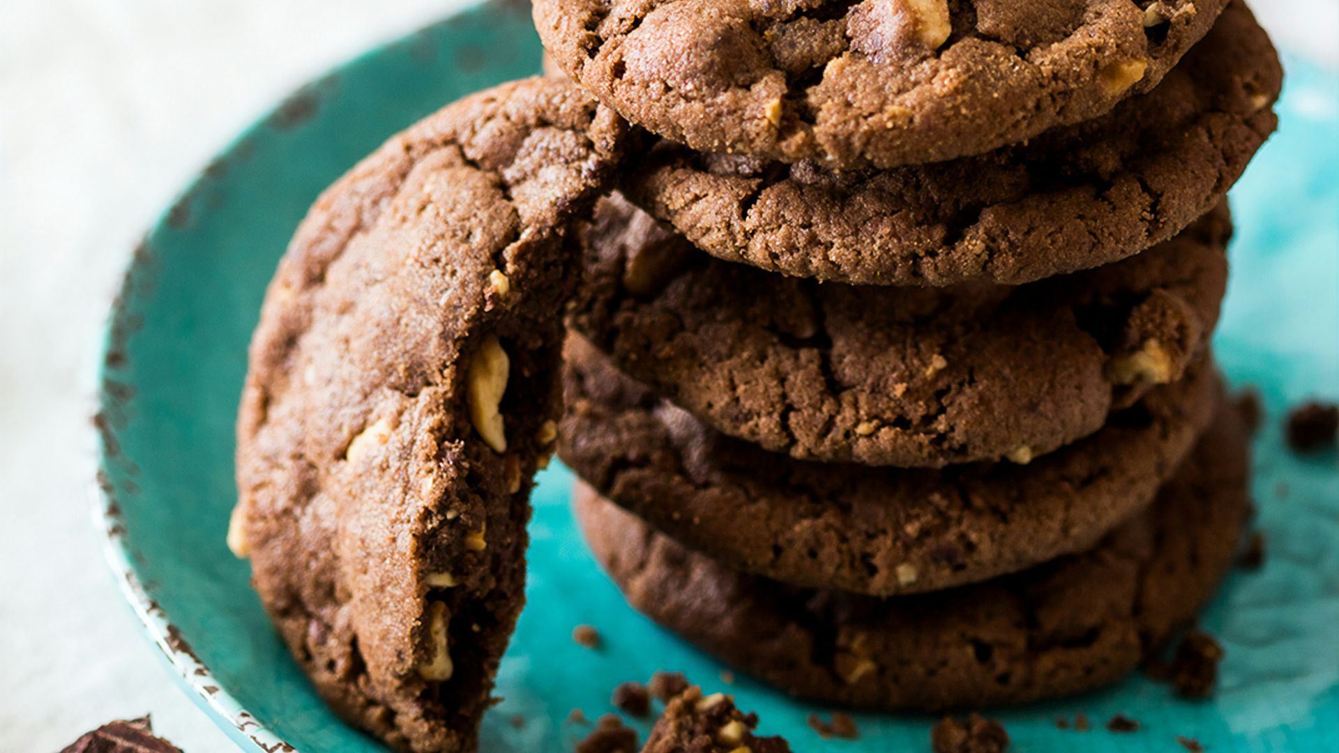 brown cookies on blue and white ceramic plate