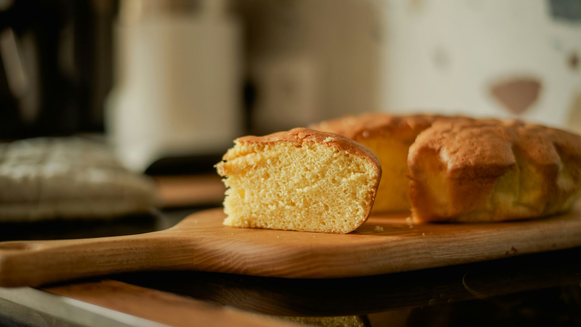 A loaf of bread sitting on top of a wooden cutting board