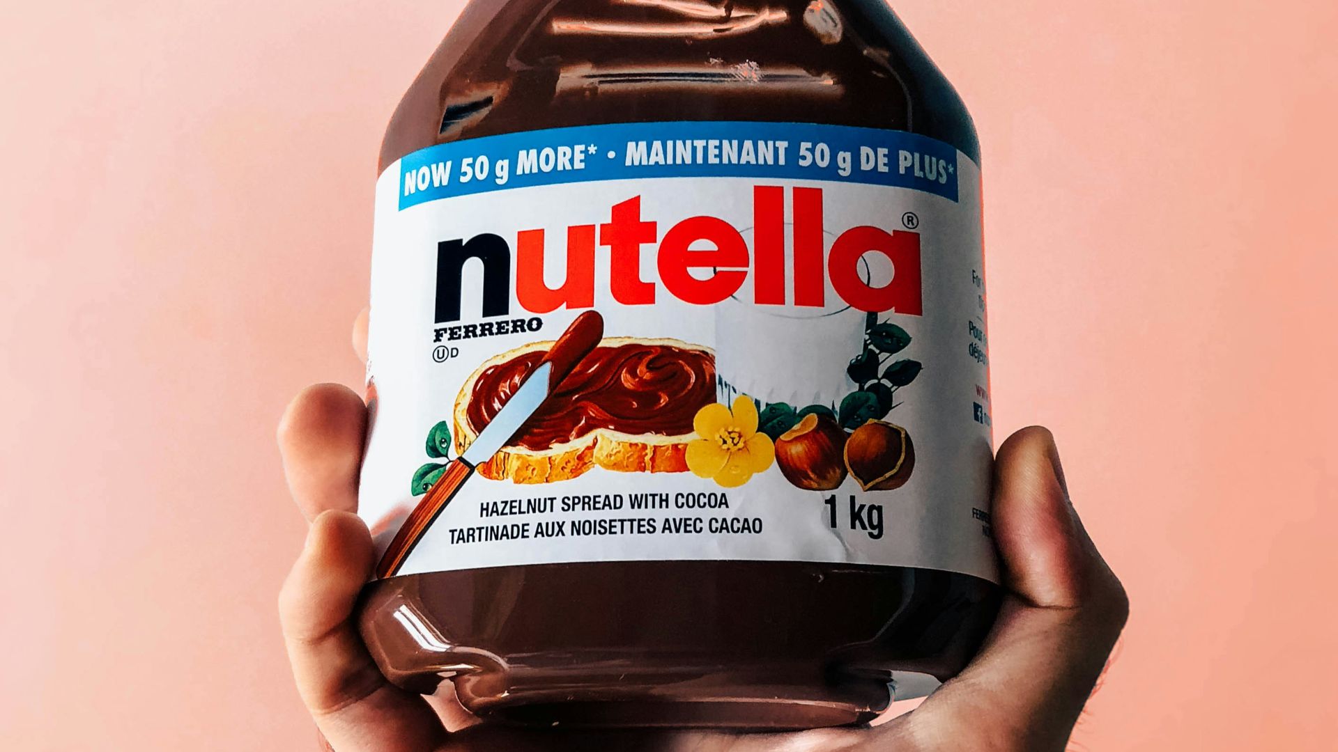 person holding Nutella jar