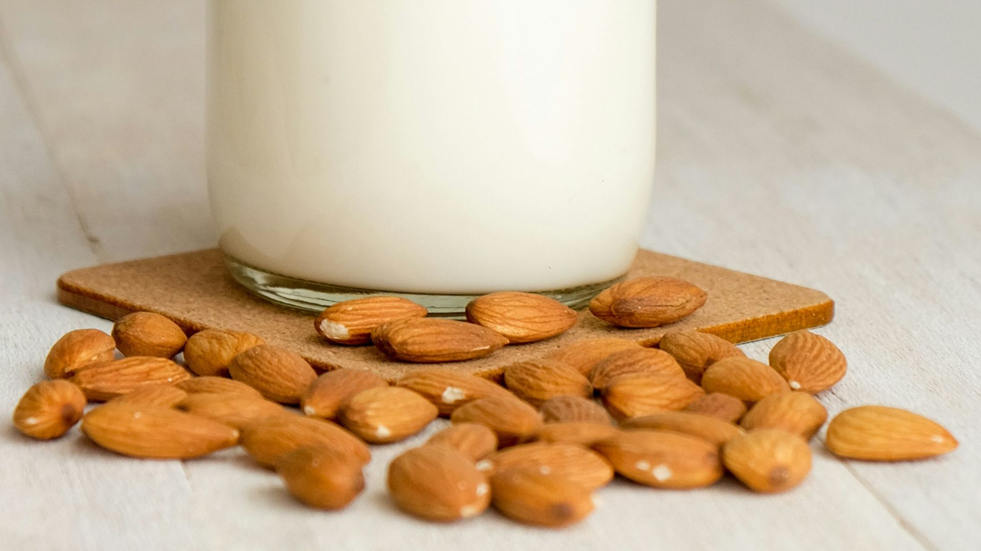 white milk in clear glass bottle