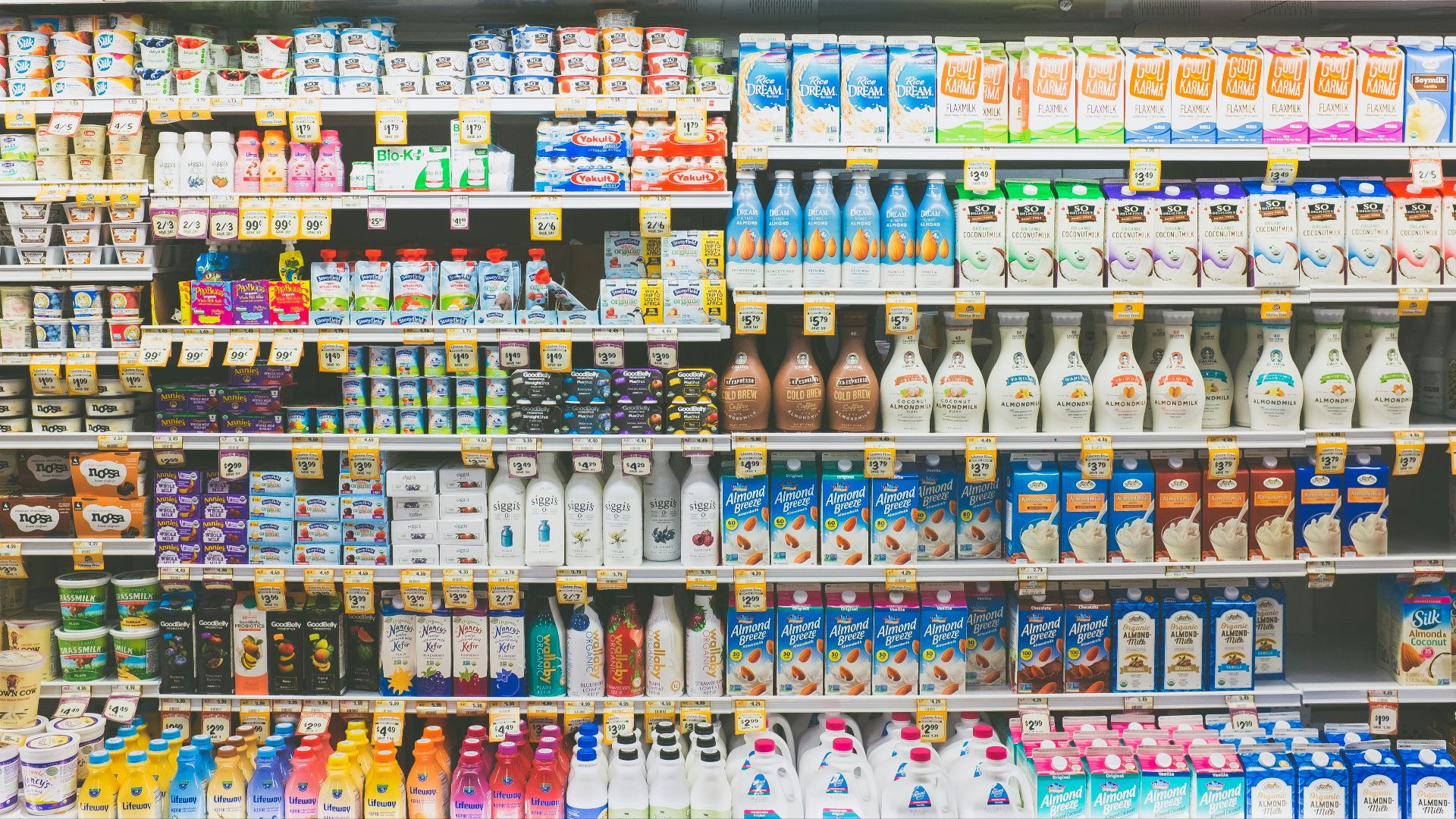 assorted drinks on white commercial refrigerator