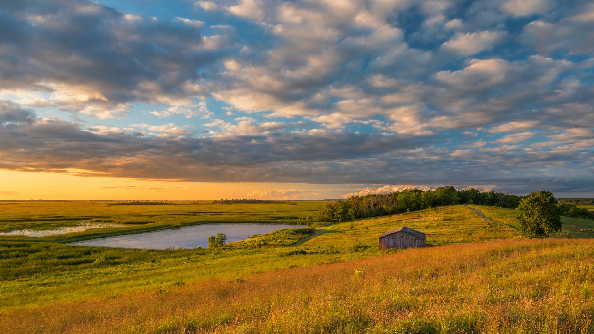 a small house on a grassy hill