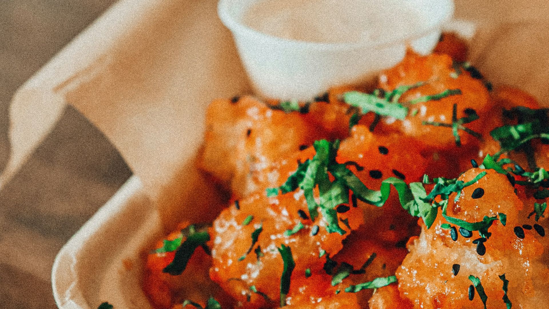 orange sauce on white ceramic bowl