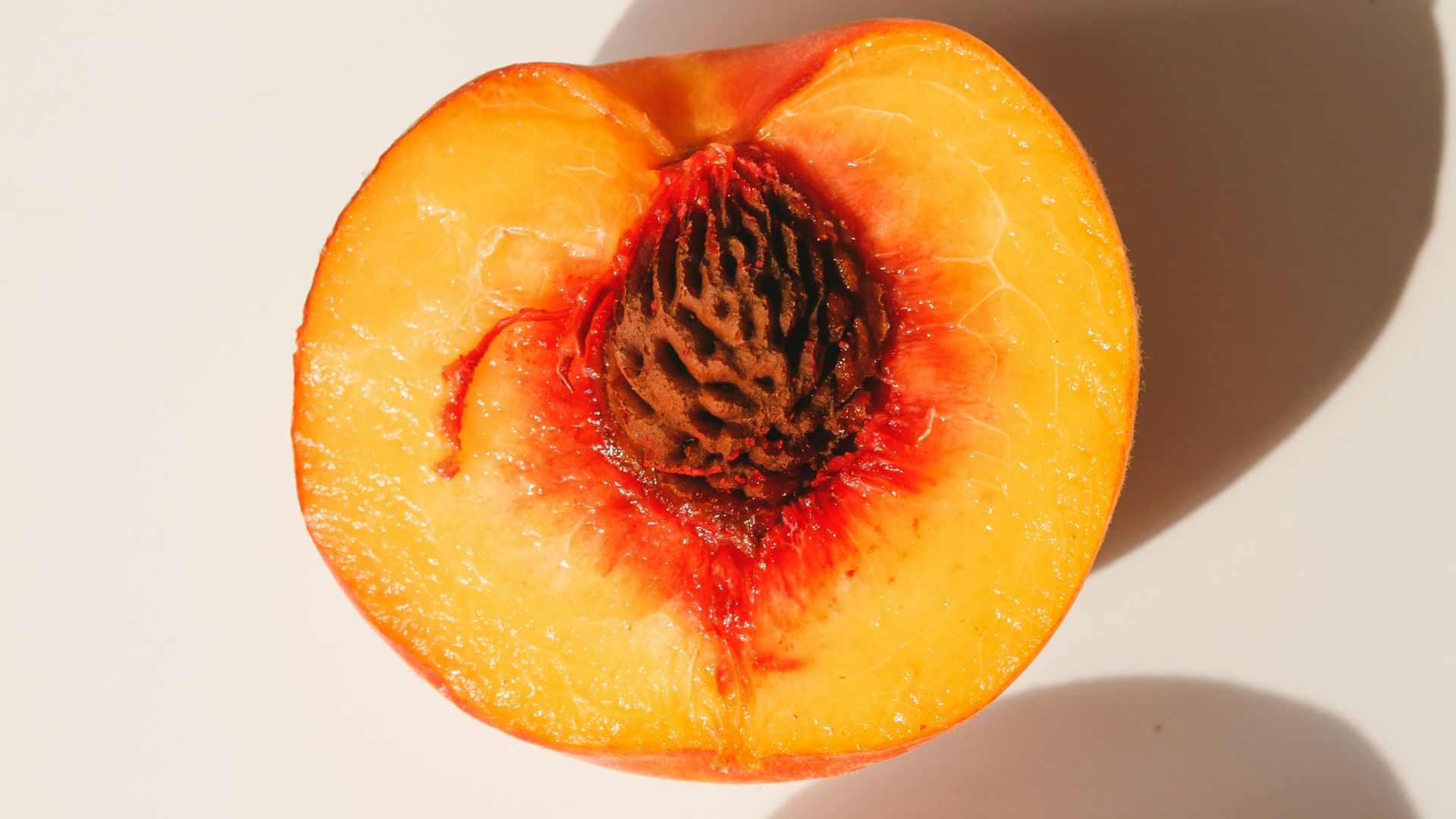 2 red and yellow peach fruits