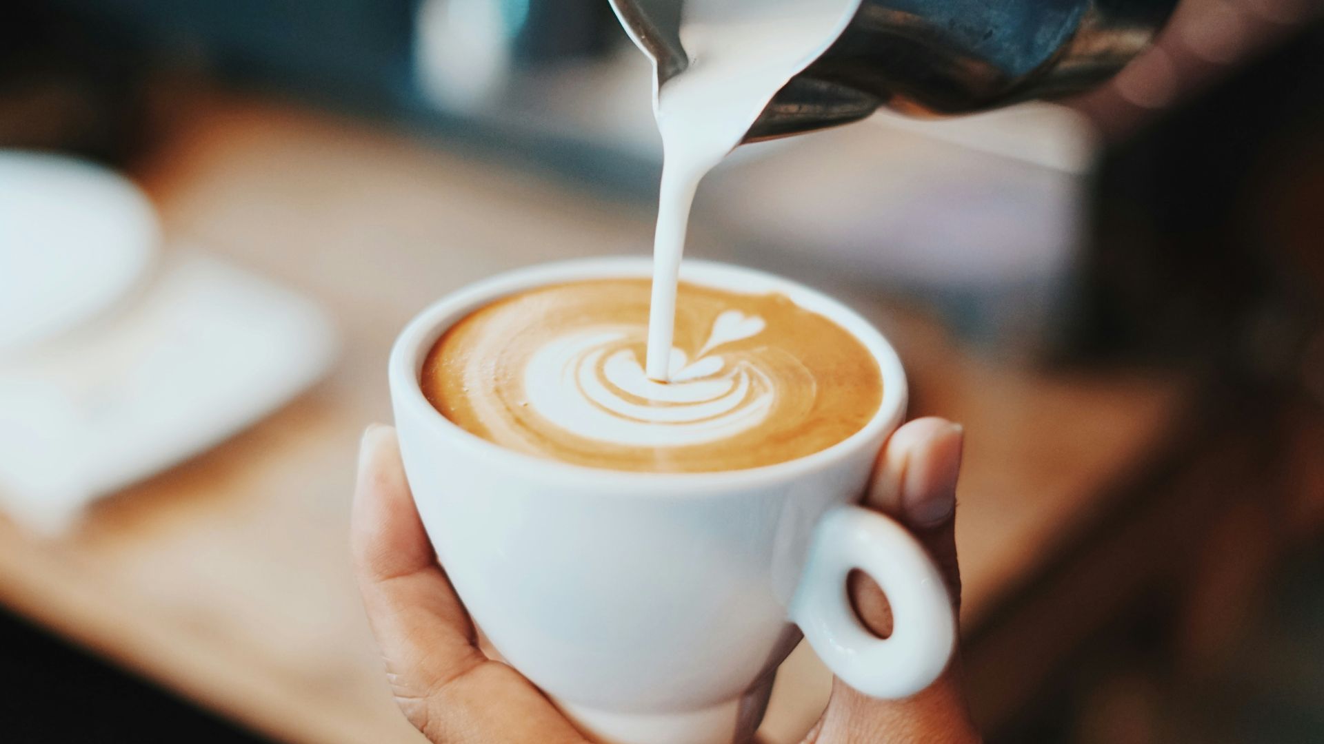 person making latte art