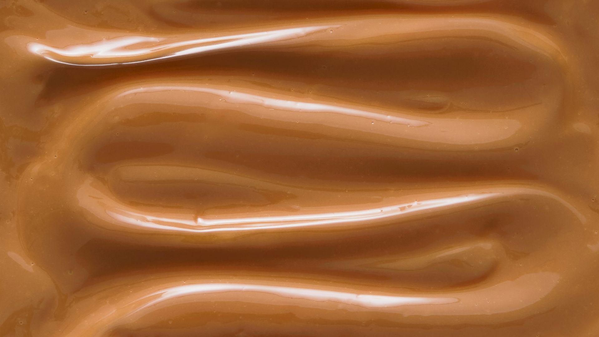 A close up of a chocolate frosted surface