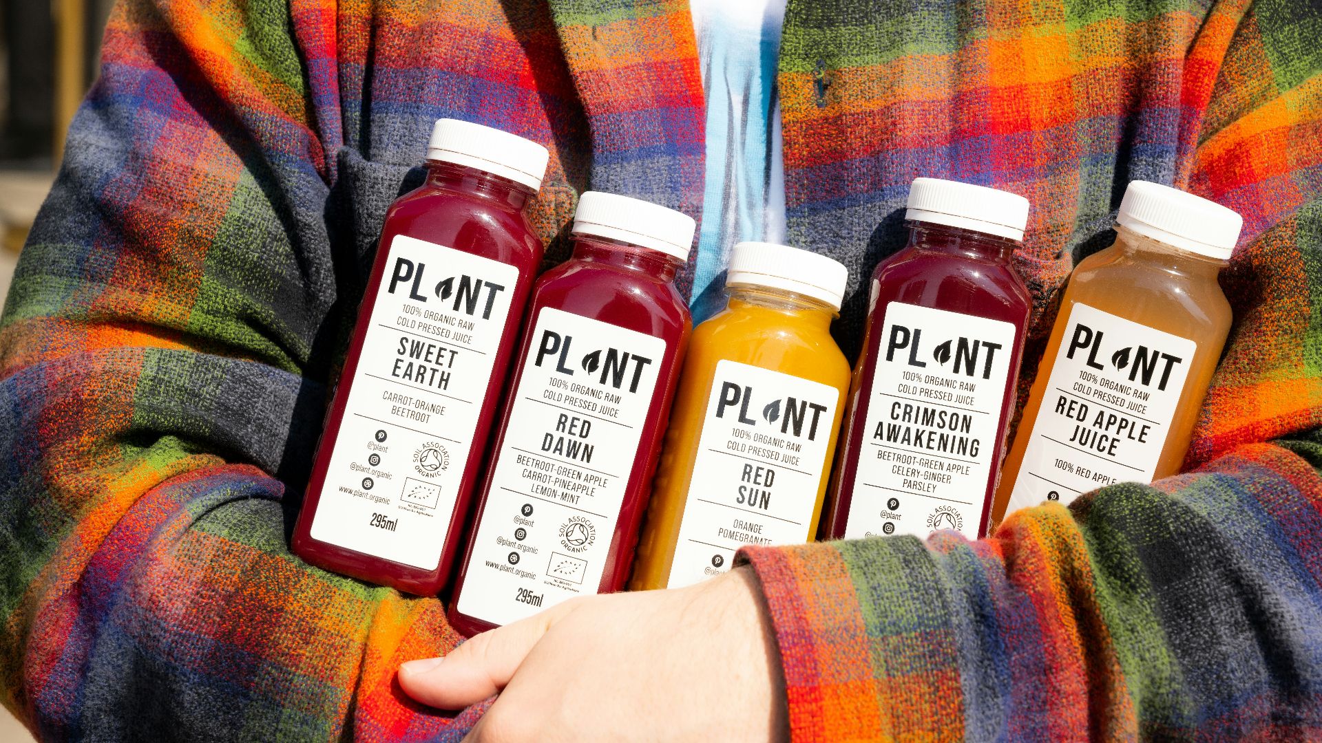 a person holding a group of bottles