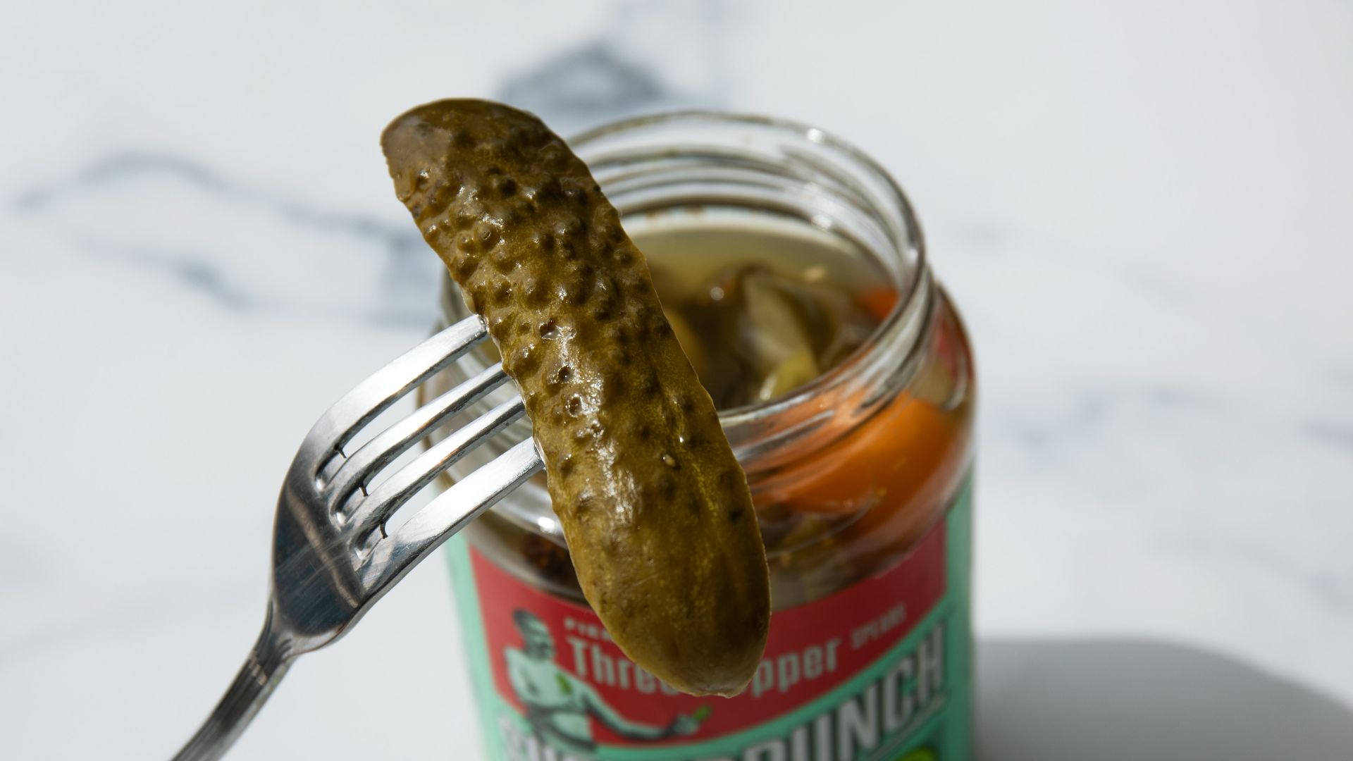 stainless steel fork on green labeled can