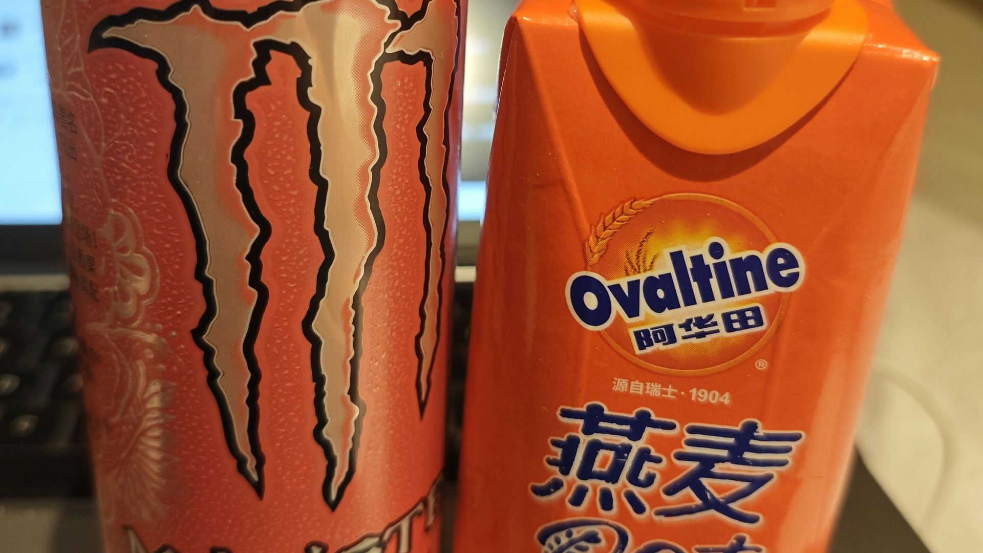 Monster energy and ovaltine oat drinks side by side.