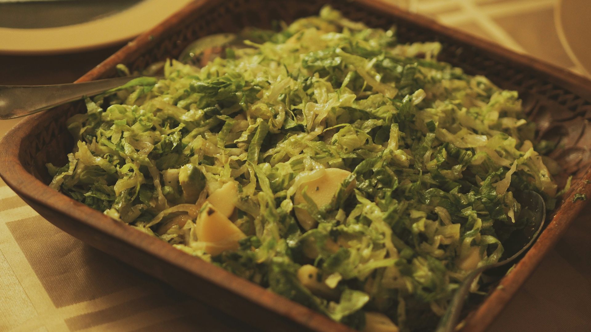 a bowl of food on a table with a fork