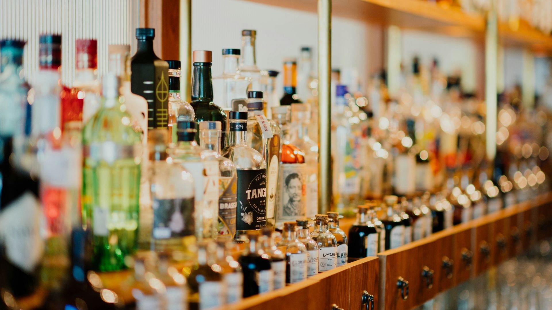 close-up photo of liquor bottles in rack