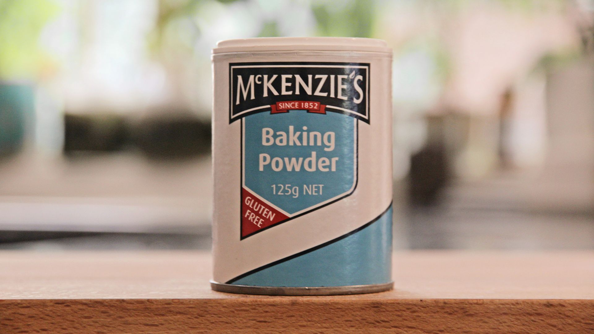 a can of baking powder sitting on a table