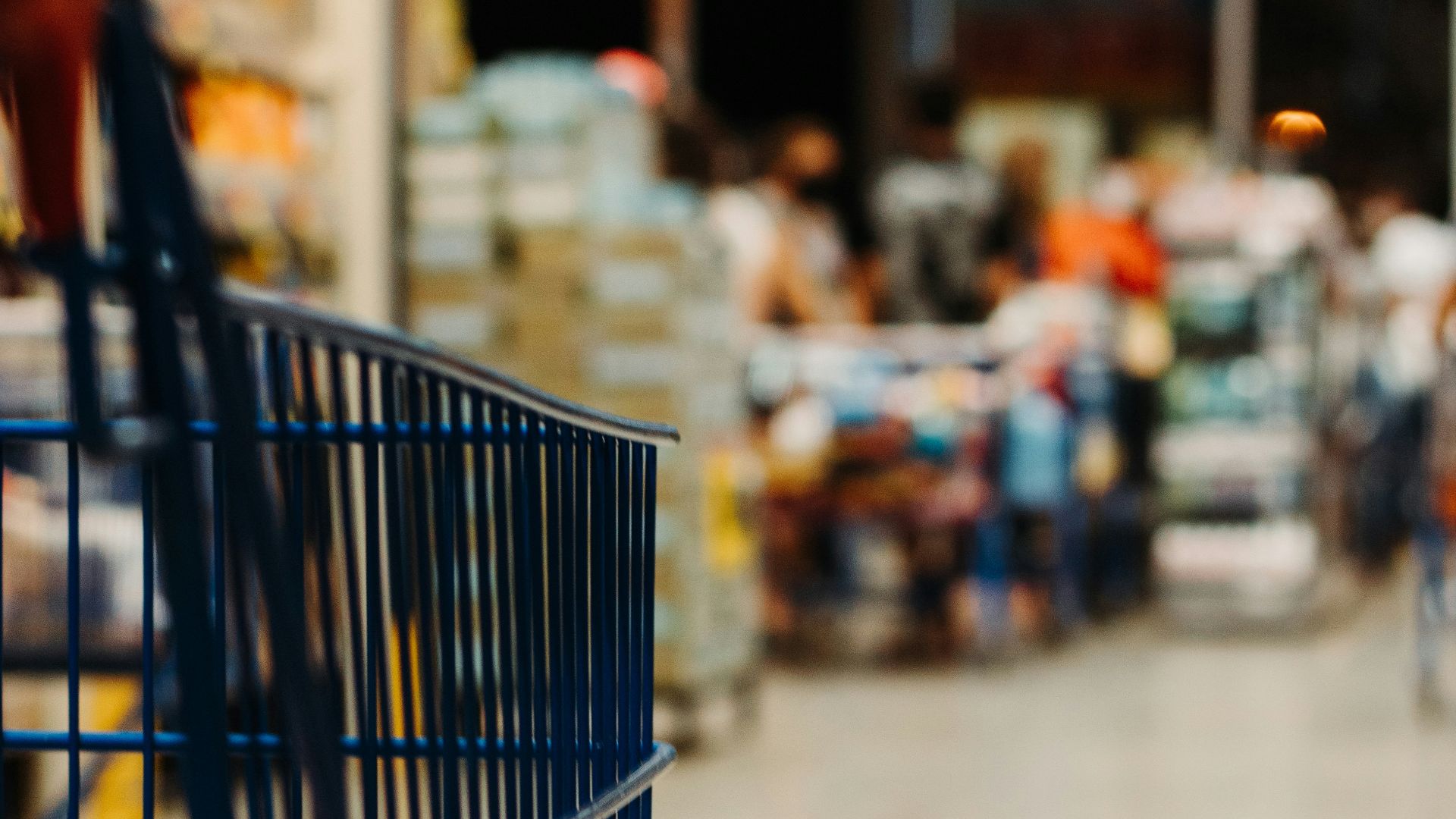 blue shopping cart on street during daytime