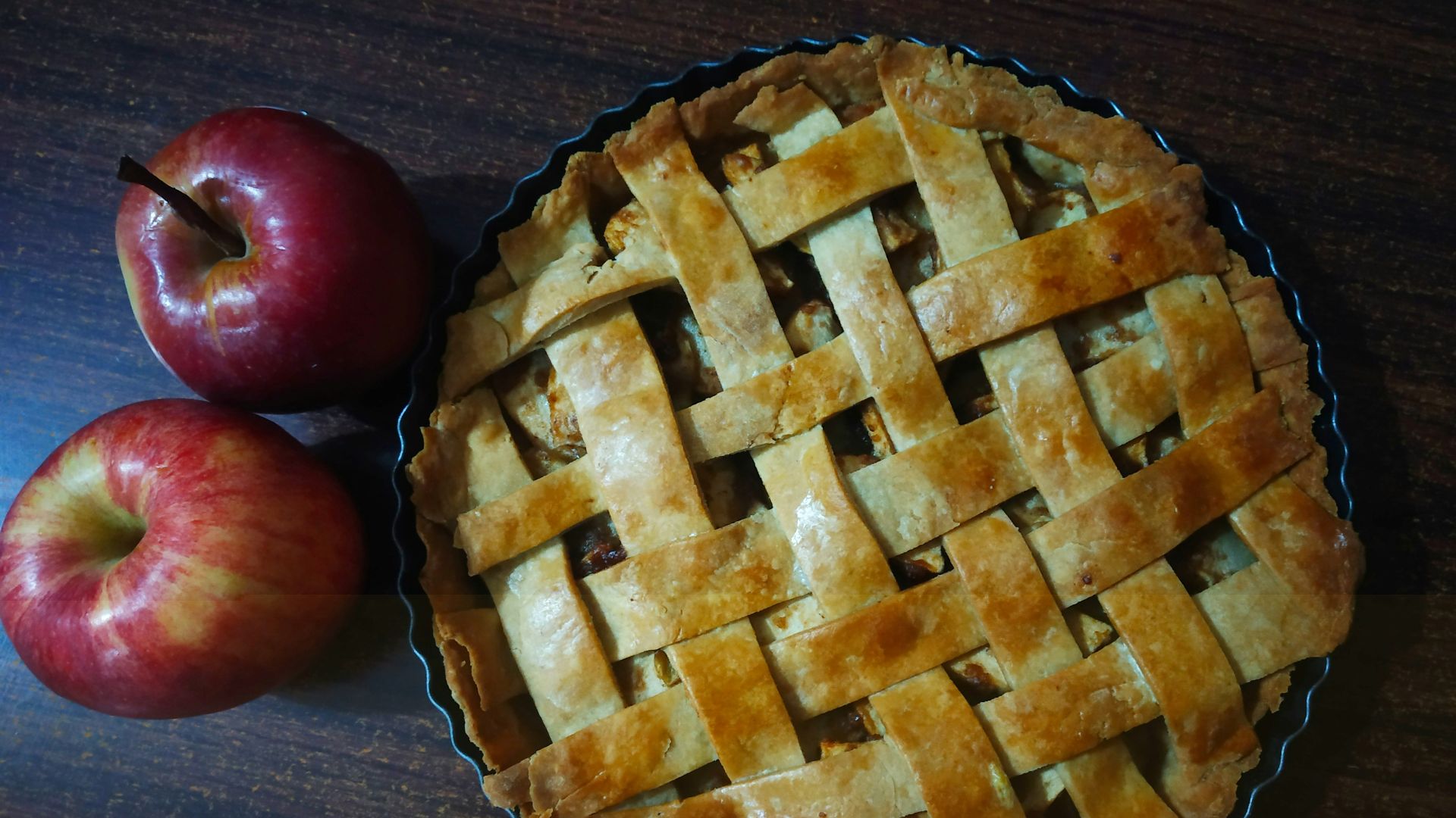 red apple beside brown pie