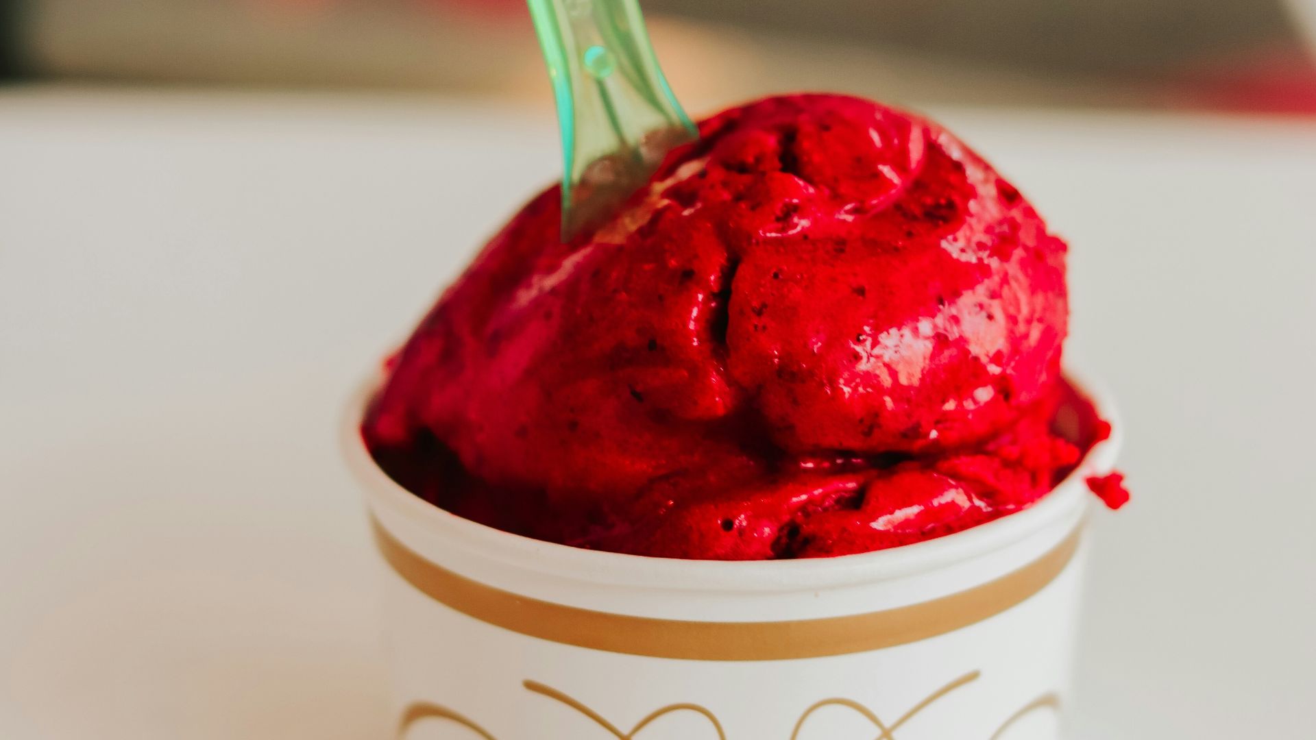 a cup of ice cream with a spoon in it