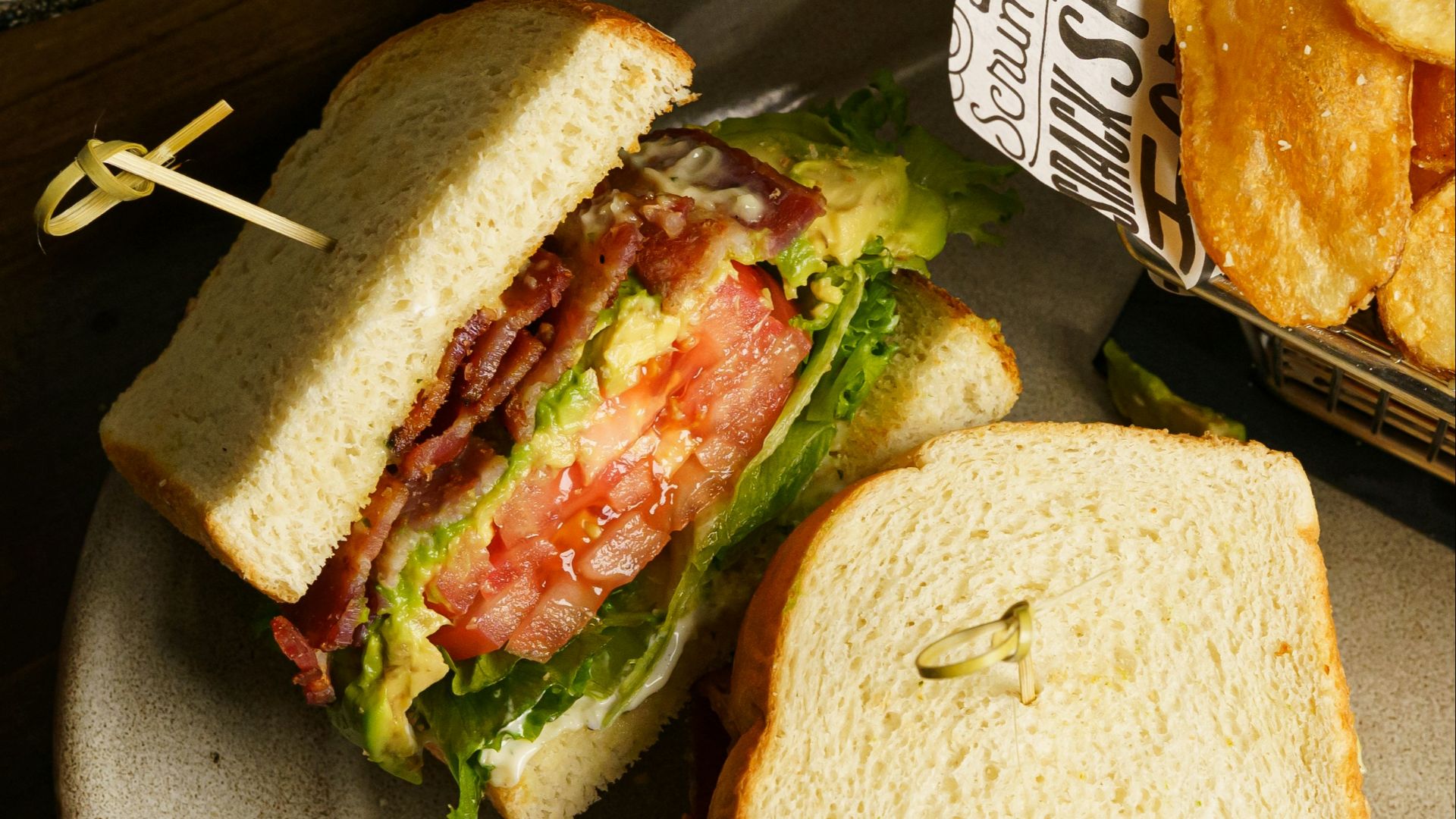 a sandwich and some onion rings on a plate