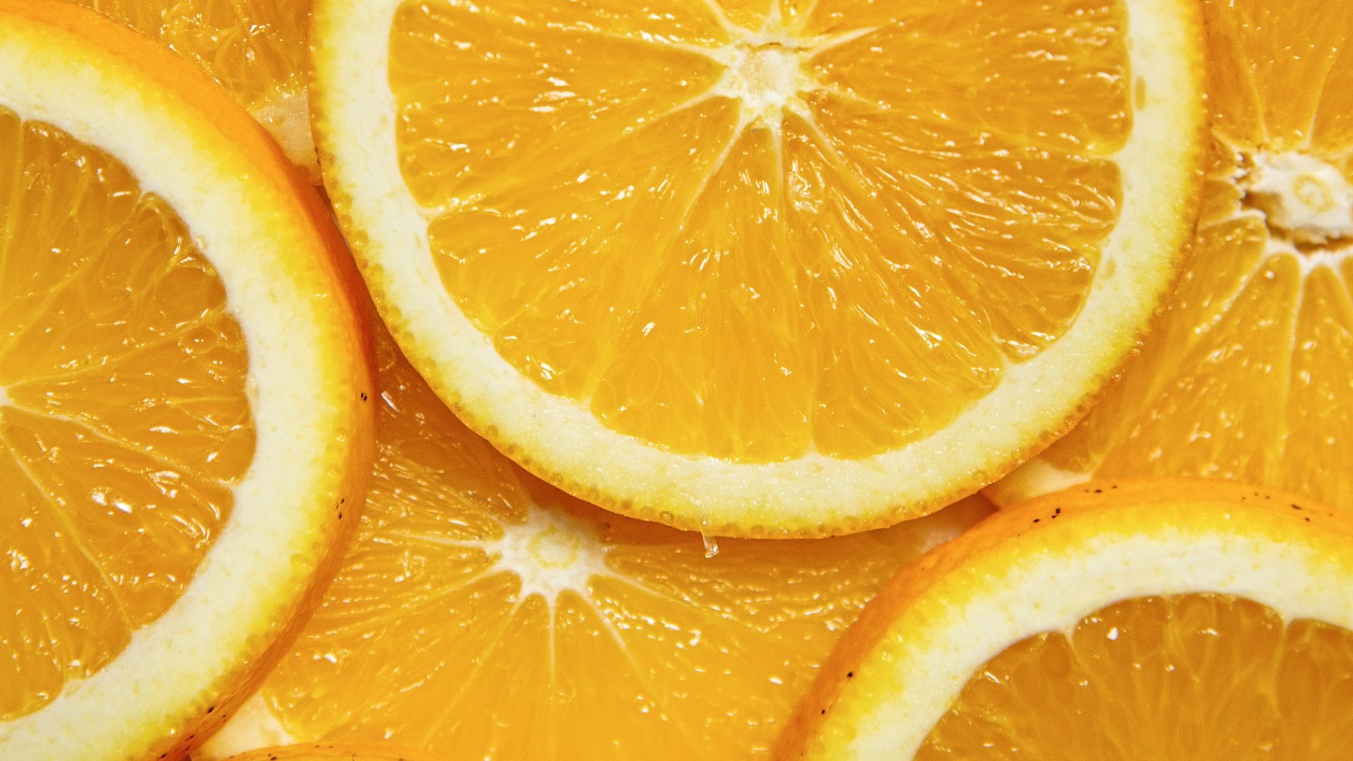 sliced orange fruit on white ceramic plate