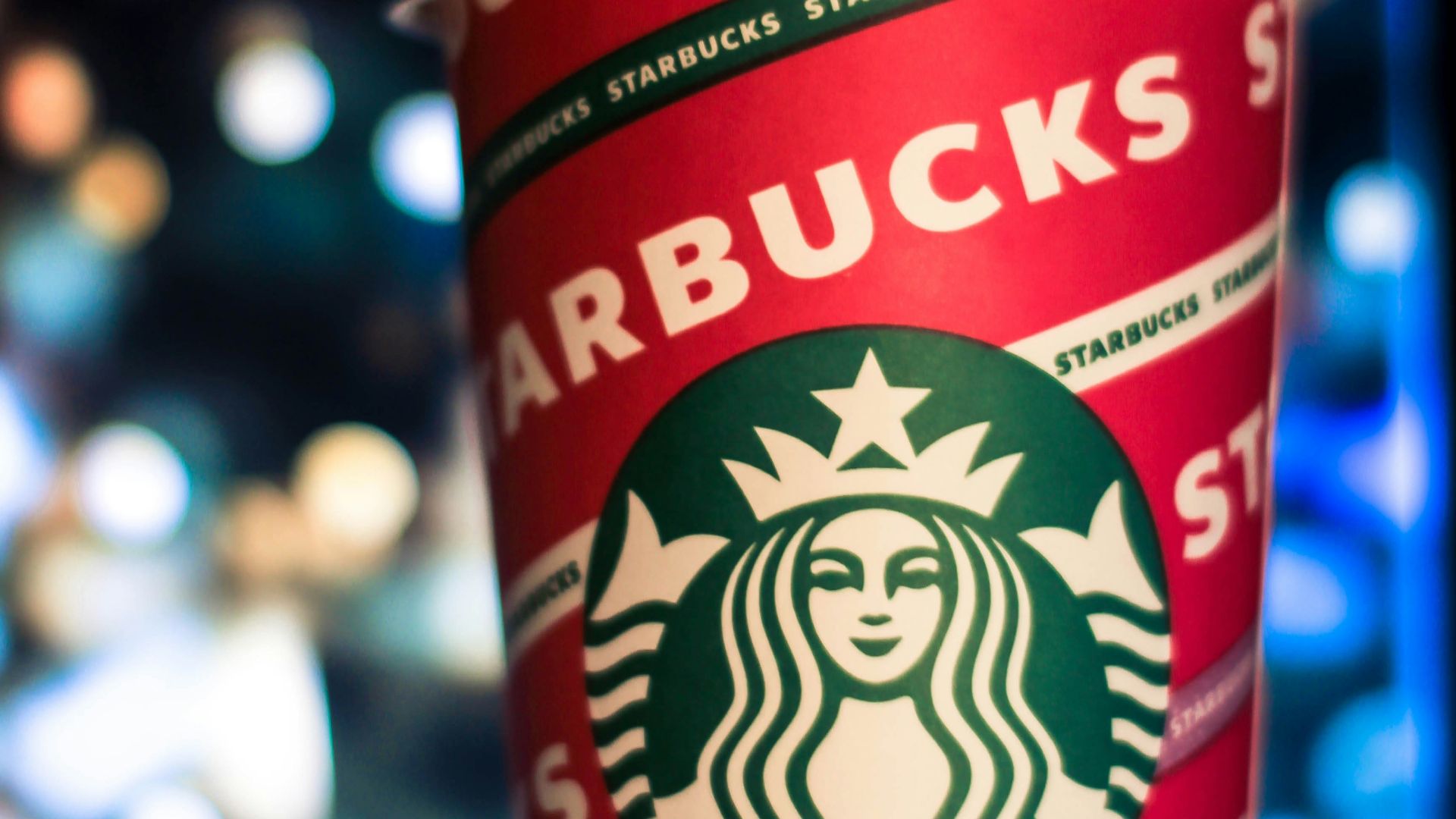 a starbucks cup sitting on top of a table