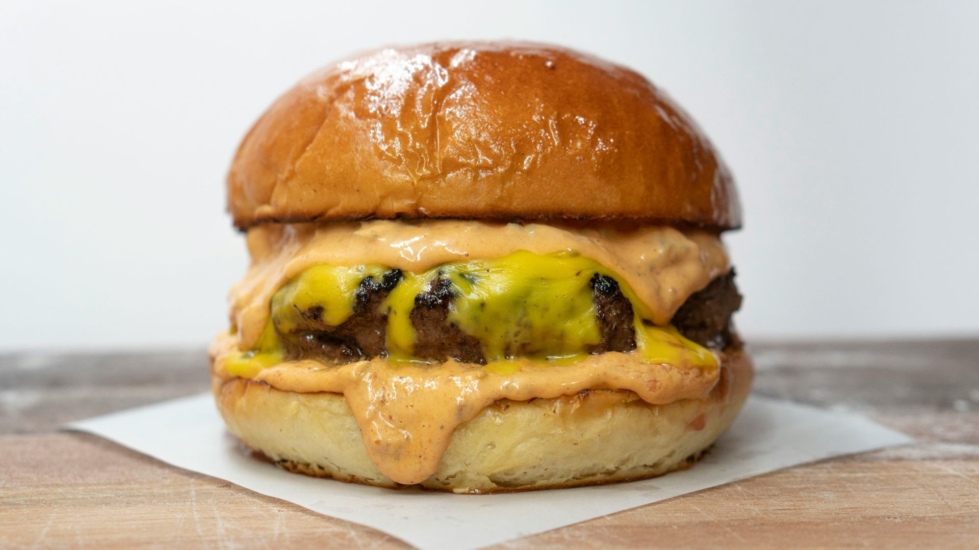 burger on brown wooden table